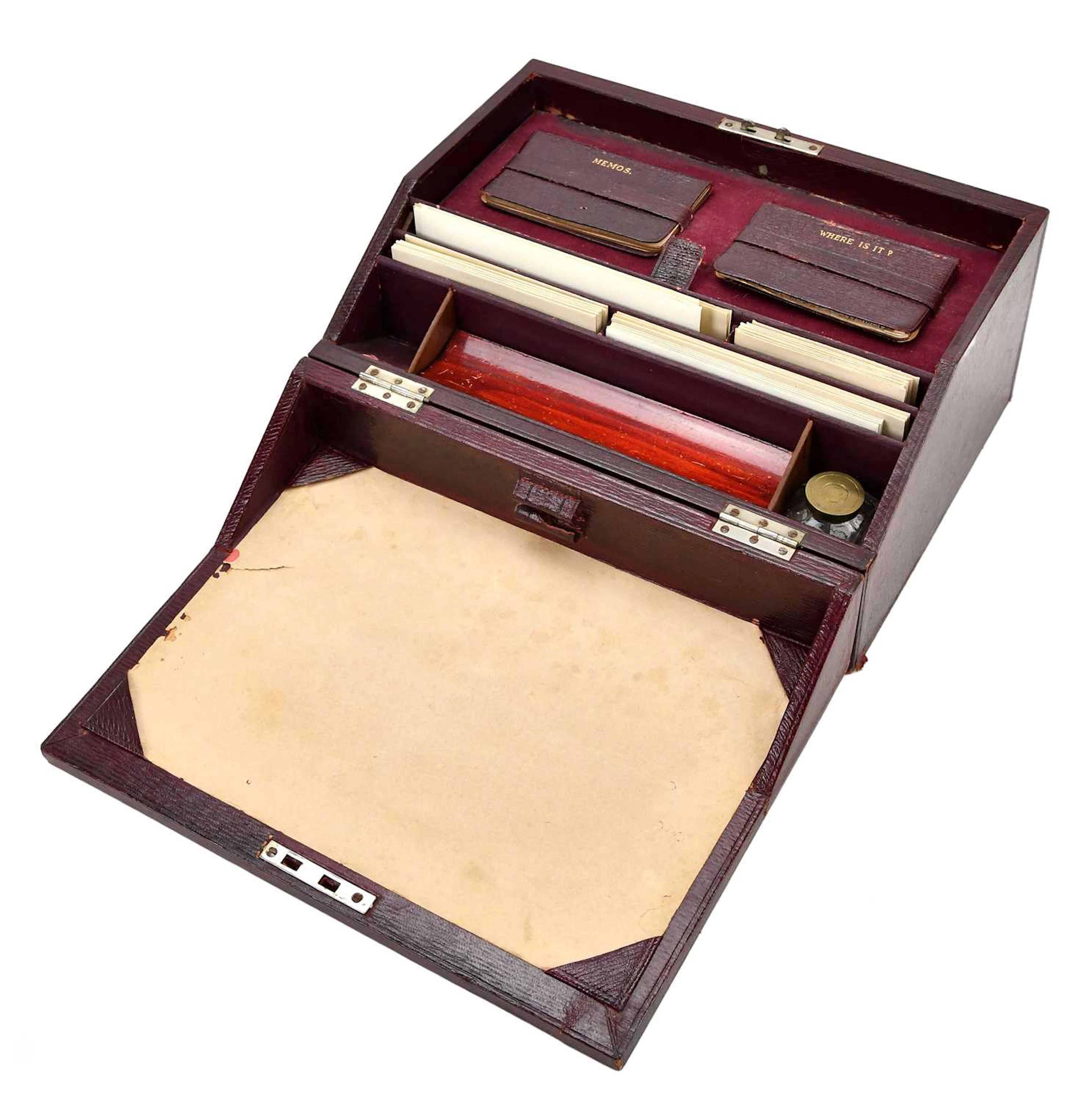 A red leather stationery box with fitted interior
