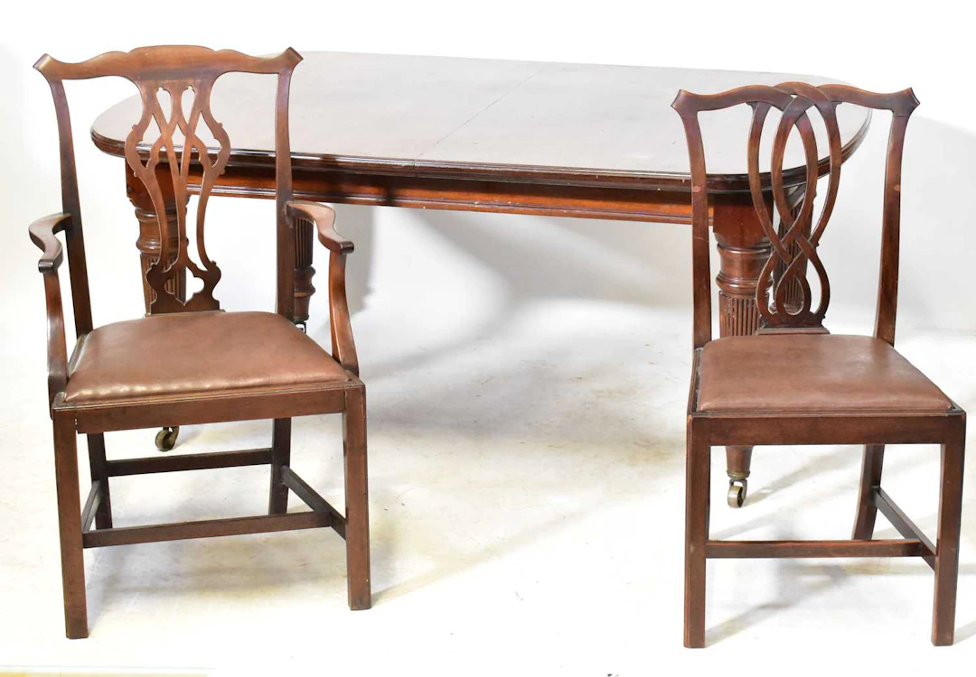 An Edwardian walnut extending dining table
