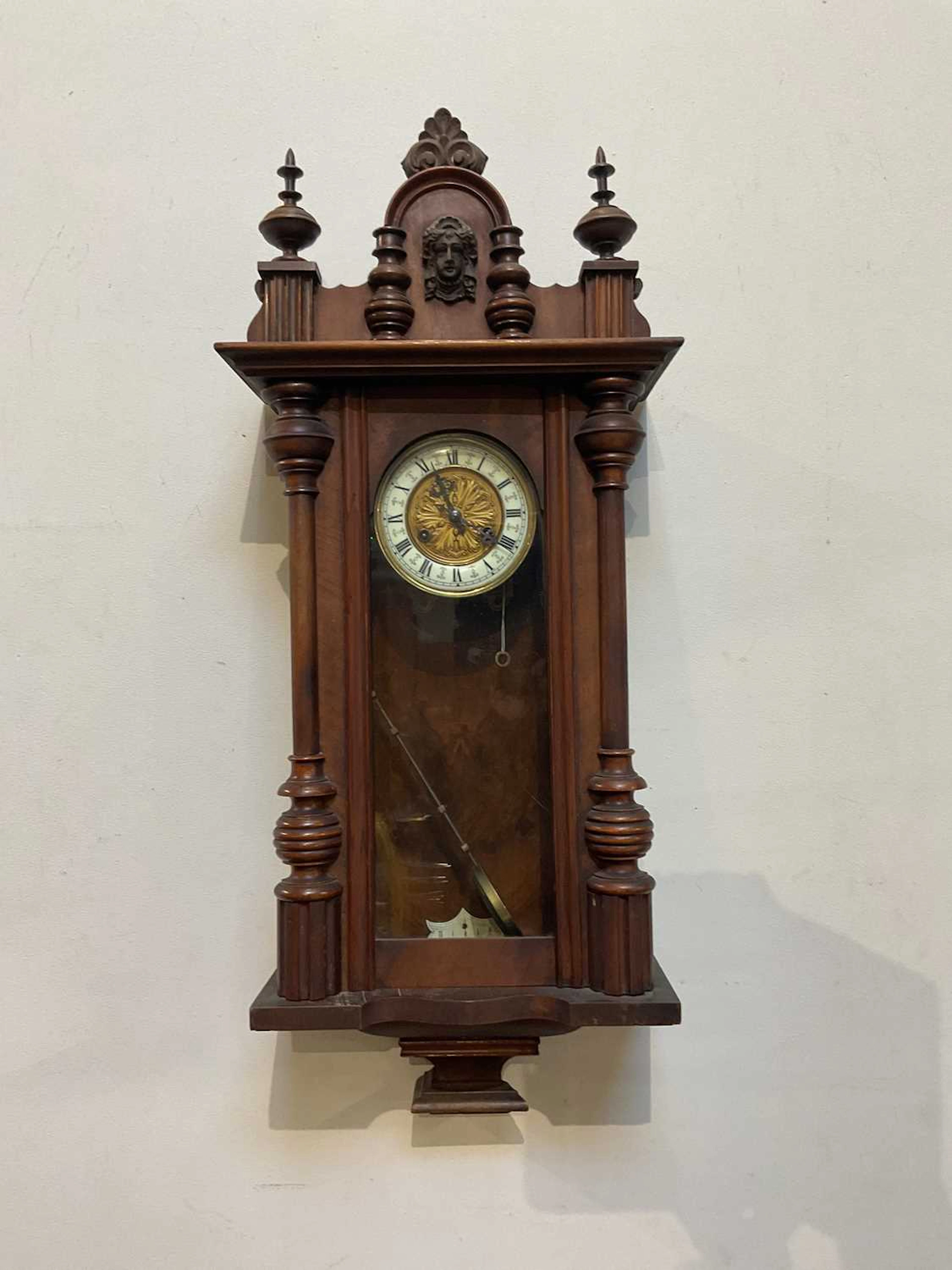 A Vienna Regulator style stained beech wall clock