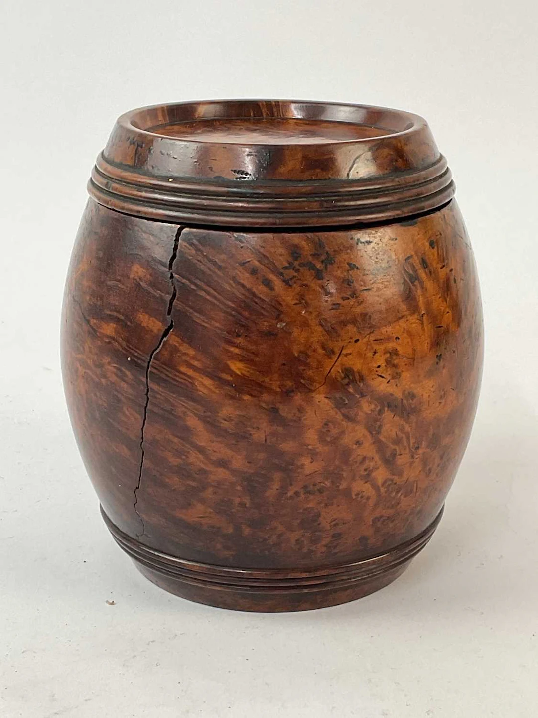 A 19th century burr walnut barrel shaped caddy