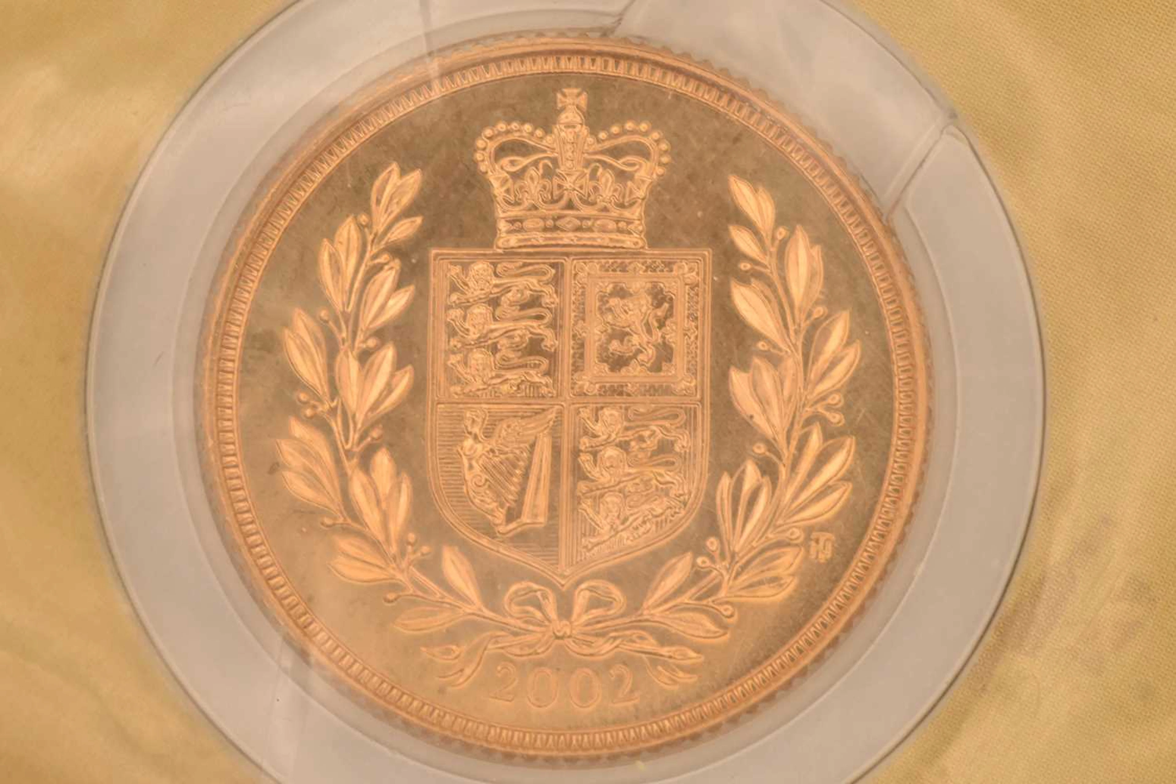 ROYAL MINT; a cased encapsulated 2002 United Kingdom 22ct gold bullion sovereign