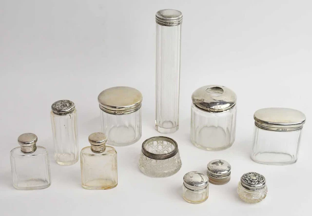 An Edward VII hallmarked silver topped cut glass hat pin jar