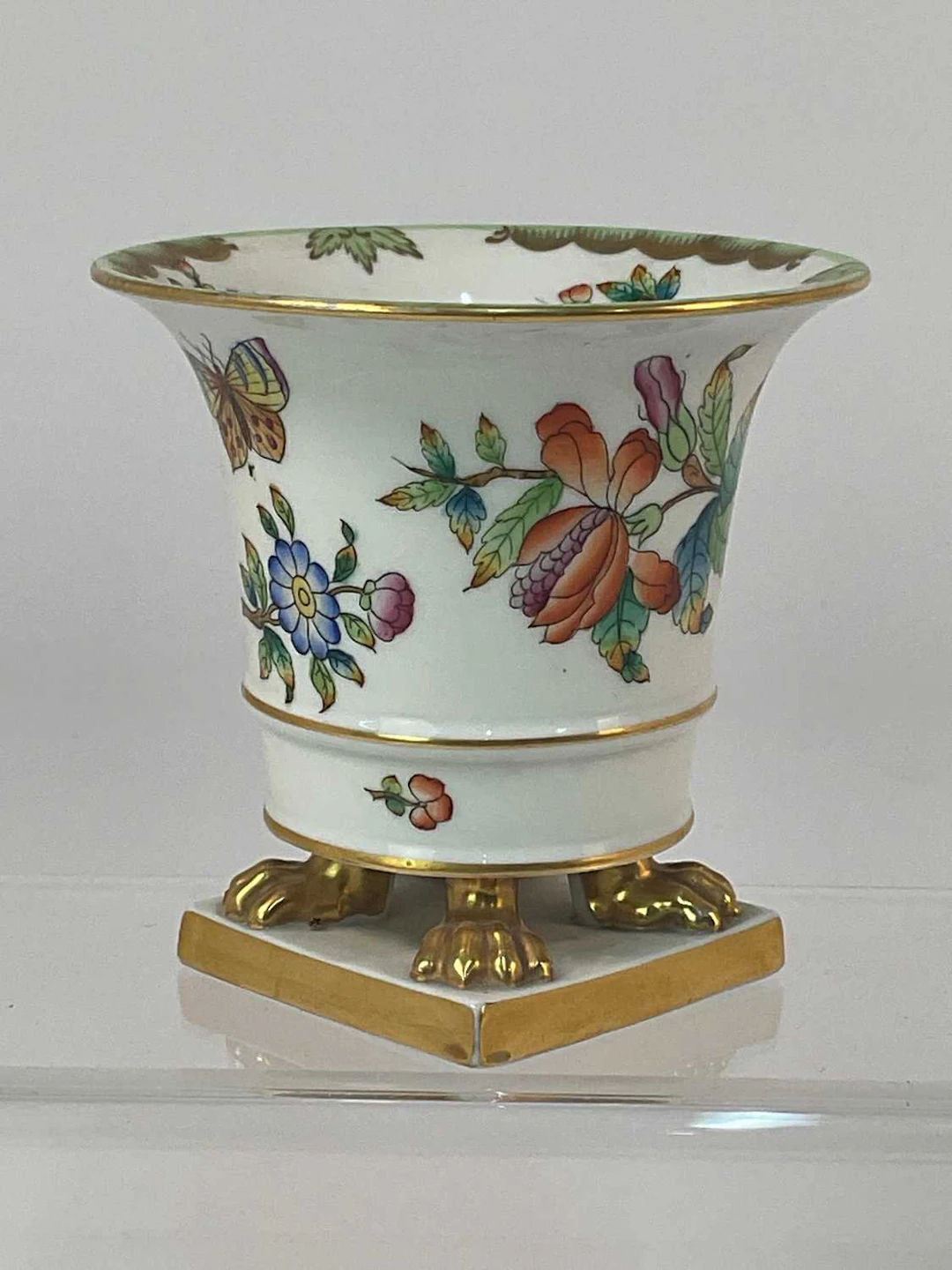HEREND; a porcelain claw footed vase decorated in the 'Queen Victoria' pattern