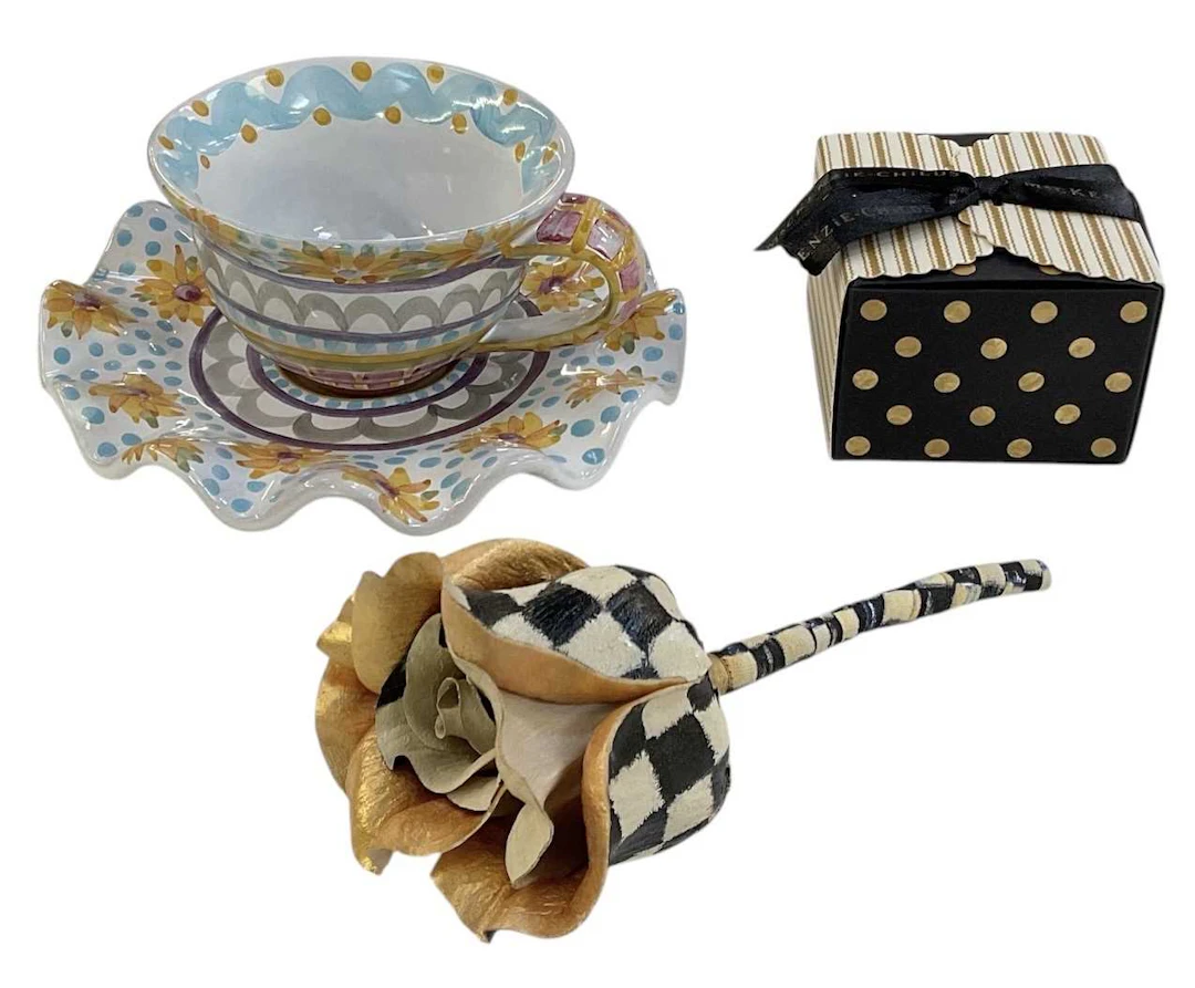 MACKENZIE-CHILDS; a modern hand painted teacup and saucer