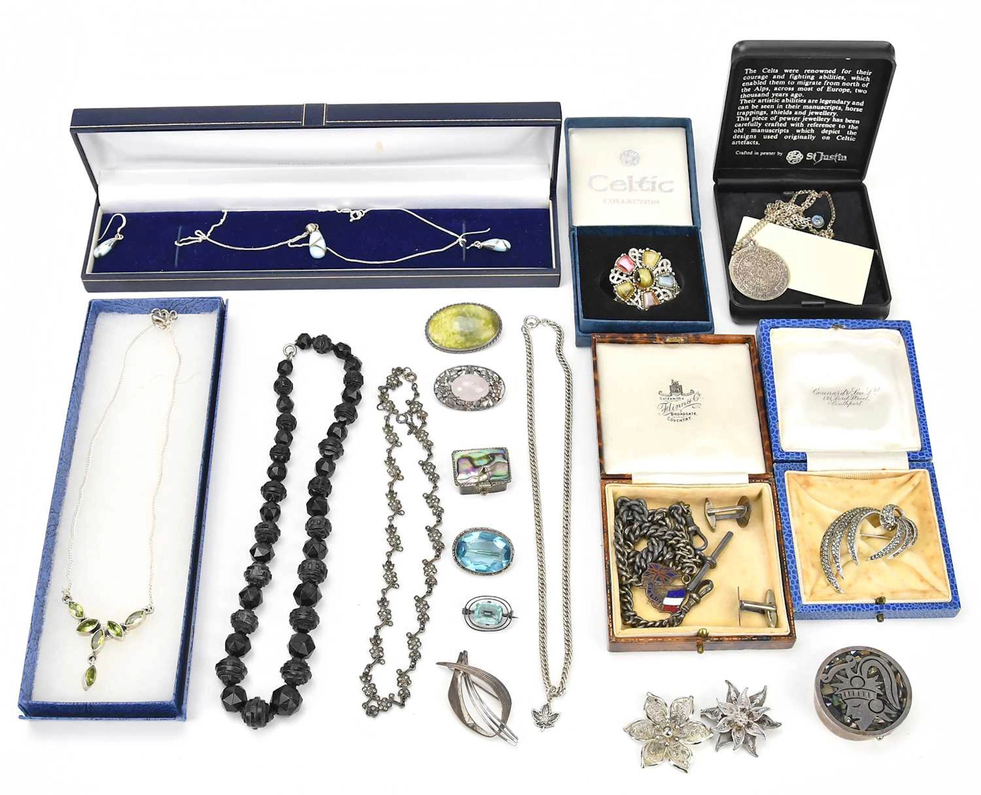 A collection of white metal and costume jewellery