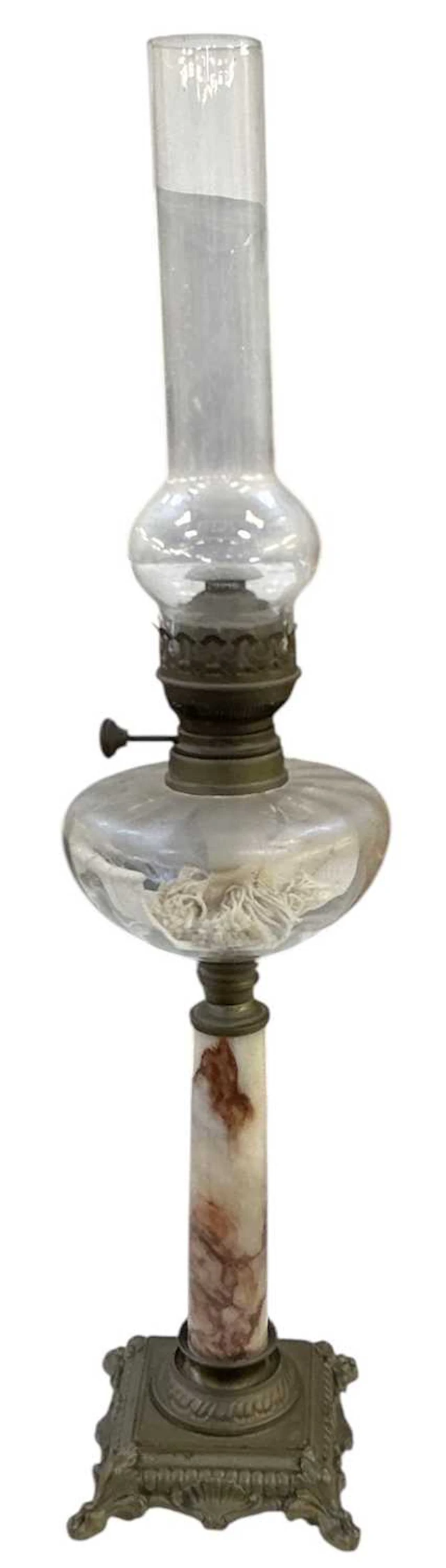 An early 20th century brass mounted rouge marble cut glass oil lamp