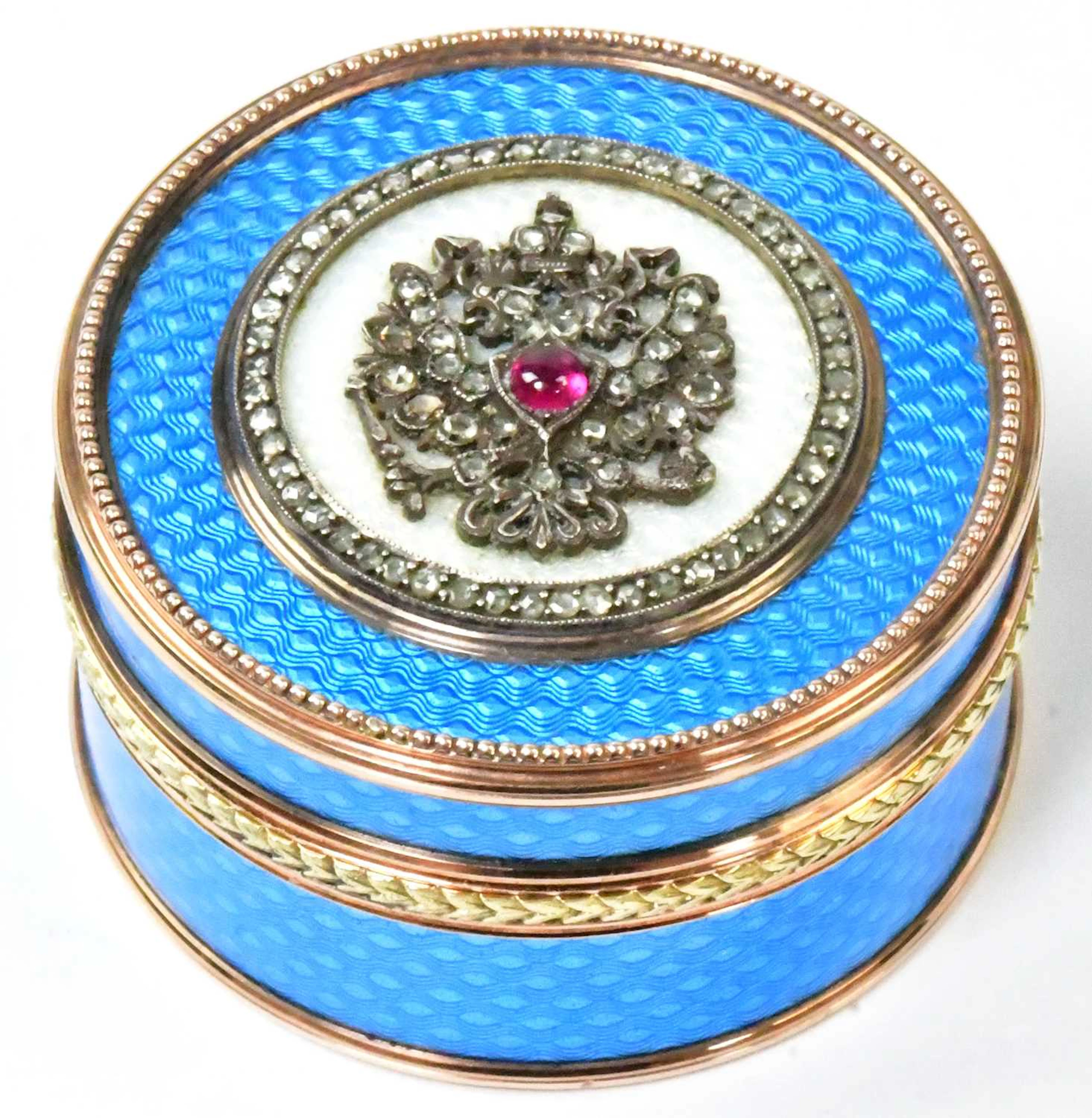 IN THE MANNER OF FABERGÉ; a Russian 14ct gold and blue guilloché enamel pillbox
