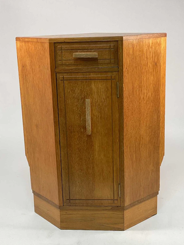 A mid 20th century Art Deco light oak corner cabinet