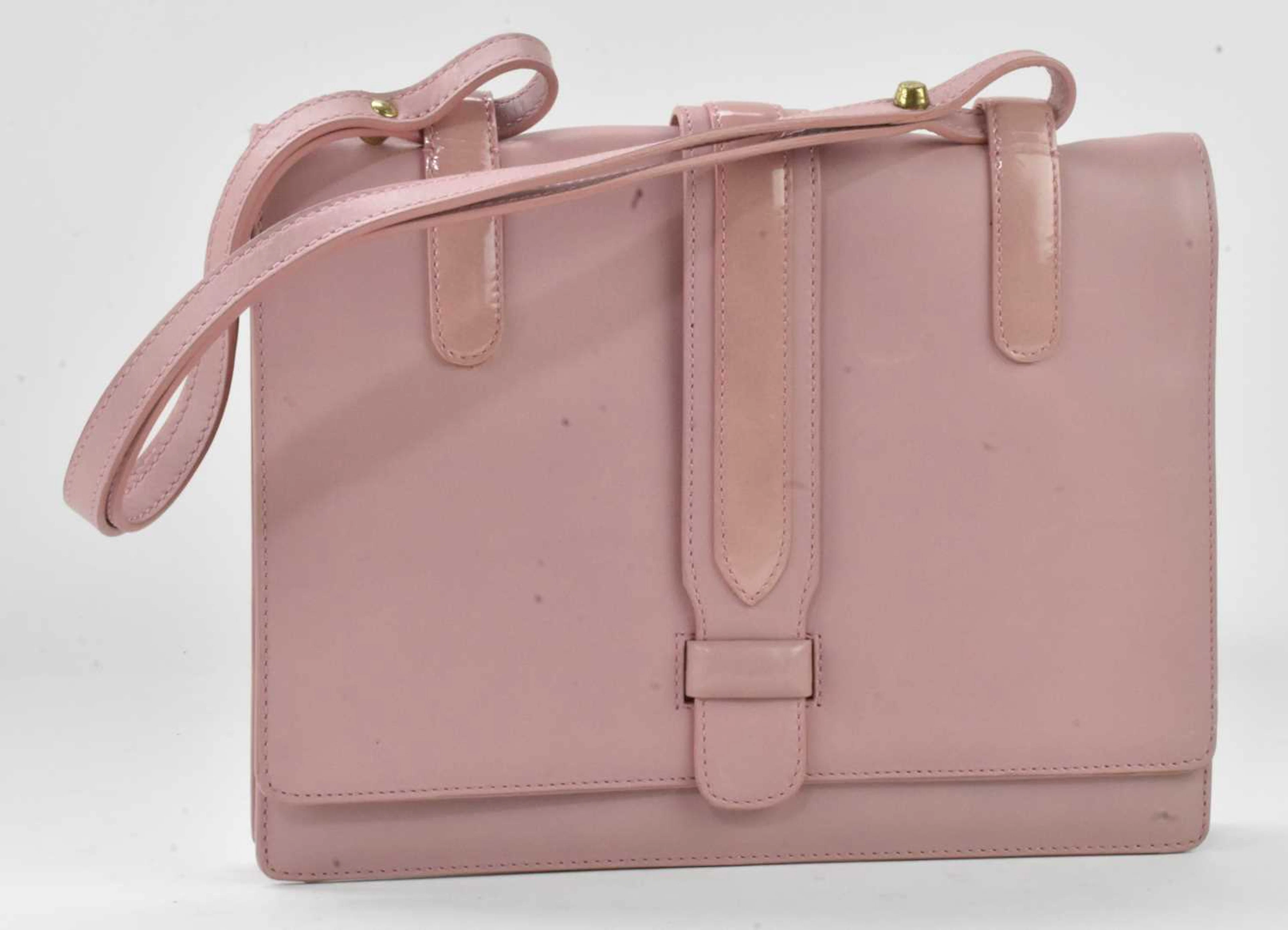 MOSCHINO; a lady's pale pink leather evening bag