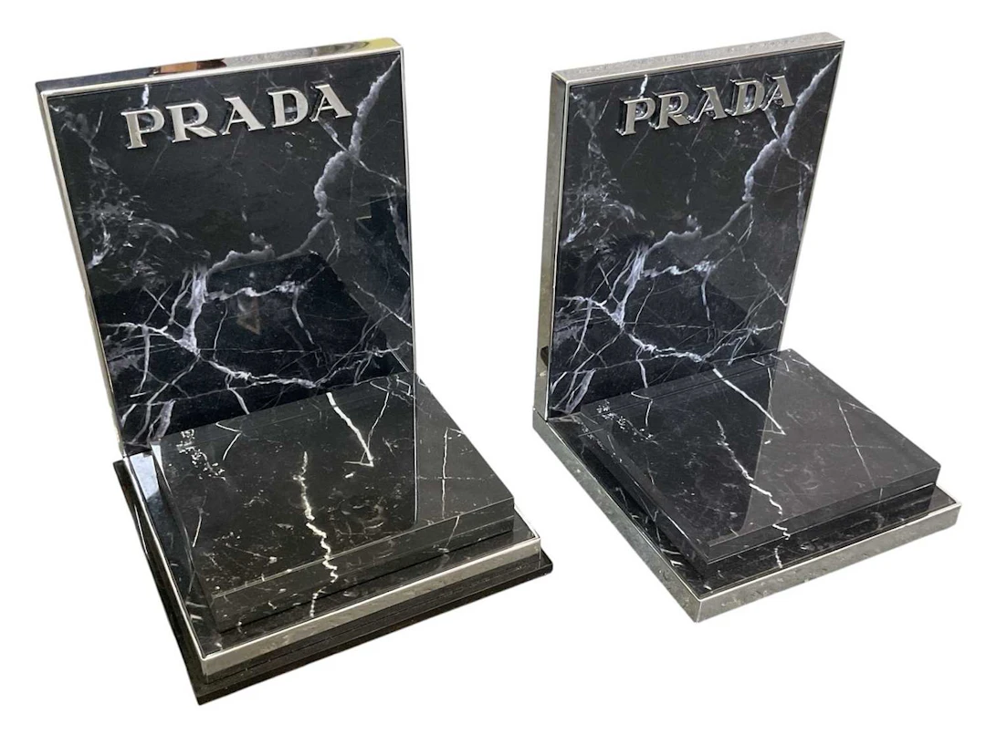 PRADA; a pair of modern contemporary chrome framed black...