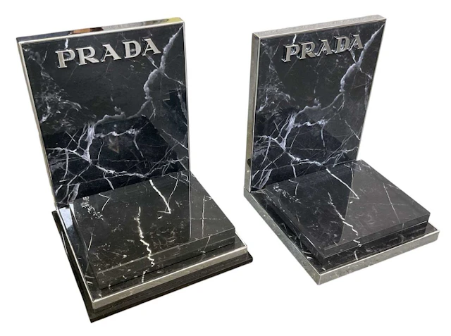 PRADA; a pair of modern contemporary chrome framed black...