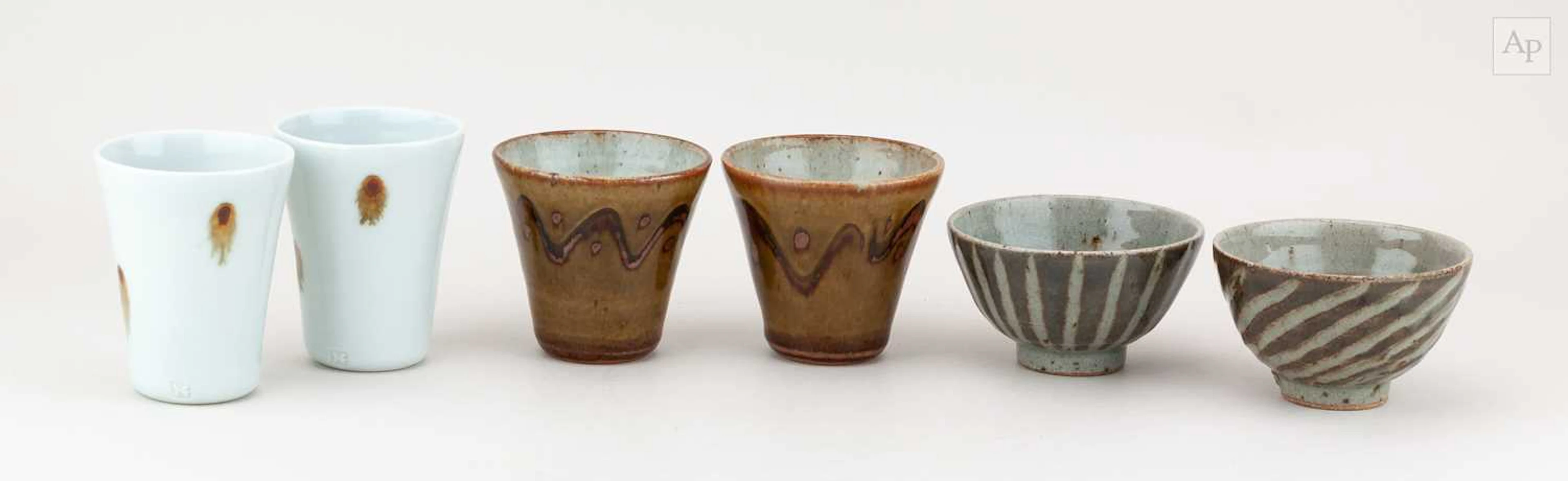 EDWARD HUGHES (1953-2006); a pair of porcelain beakers...