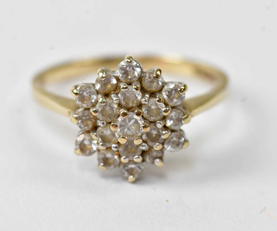 A 9ct yellow gold cluster ring set with white stones