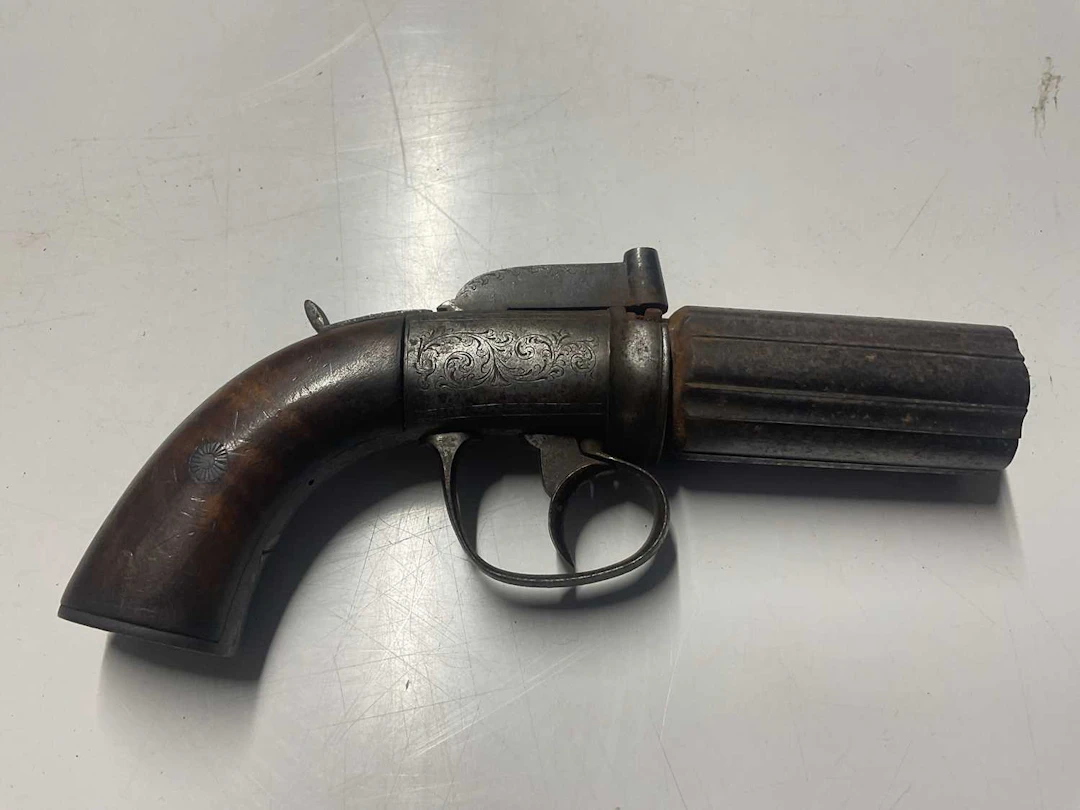 An early 19th century six shot pepperpot pistol