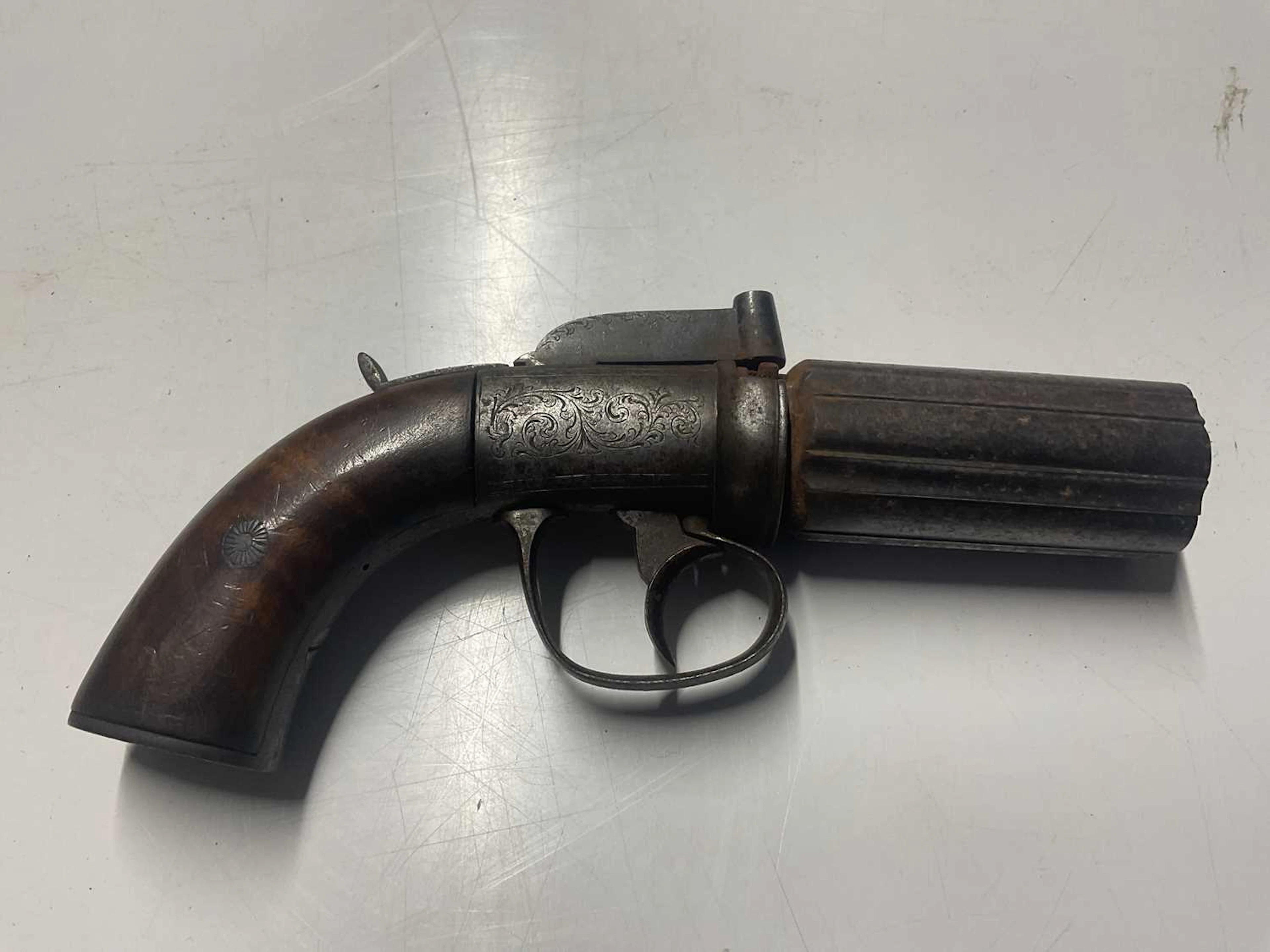An early 19th century six shot pepperpot pistol