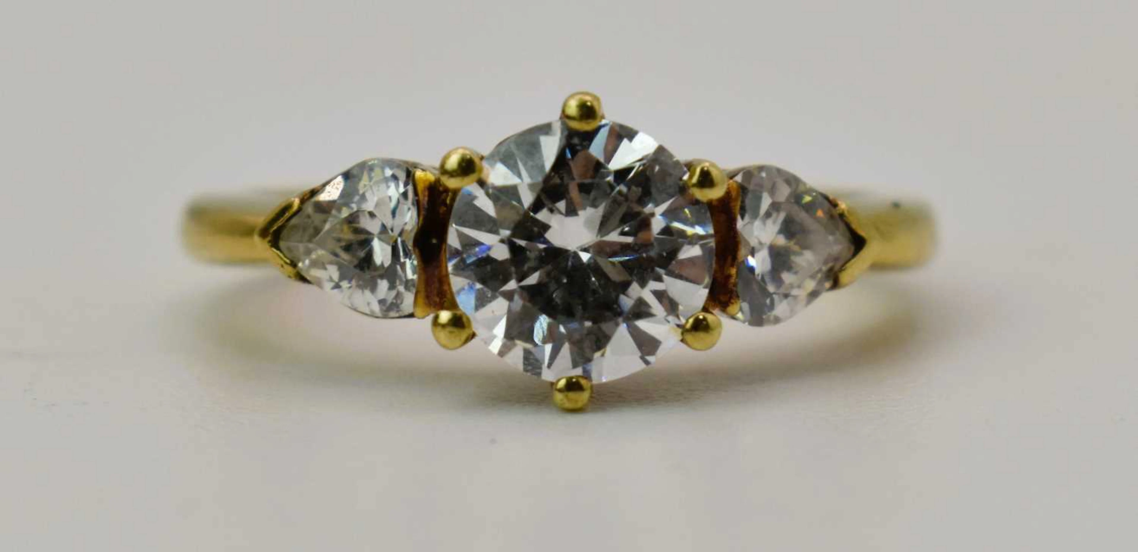 An 18ct gold and white stone engagement ring