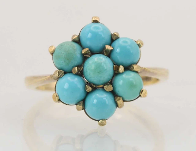 A 9ct yellow gold turquoise set flower head cluster ring