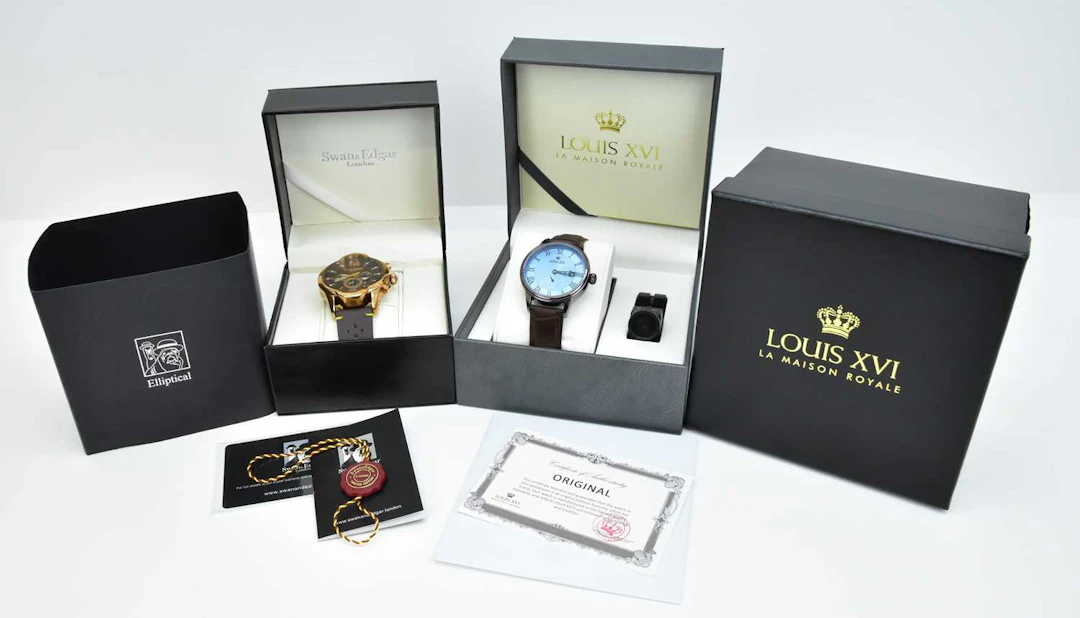 Two modern gentleman's dress watches comprising a Swan...