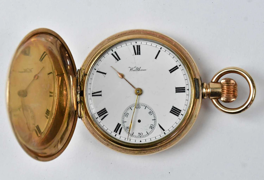 WALTHAM; a gold-plated full hunter pocket crown wind watch