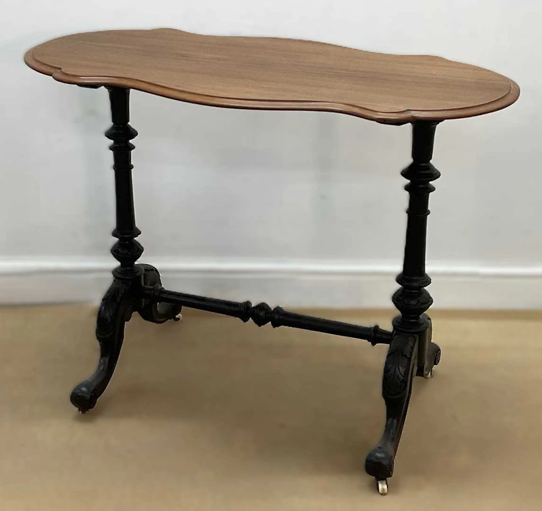 A mahogany topped centre table with turned ebonised legs