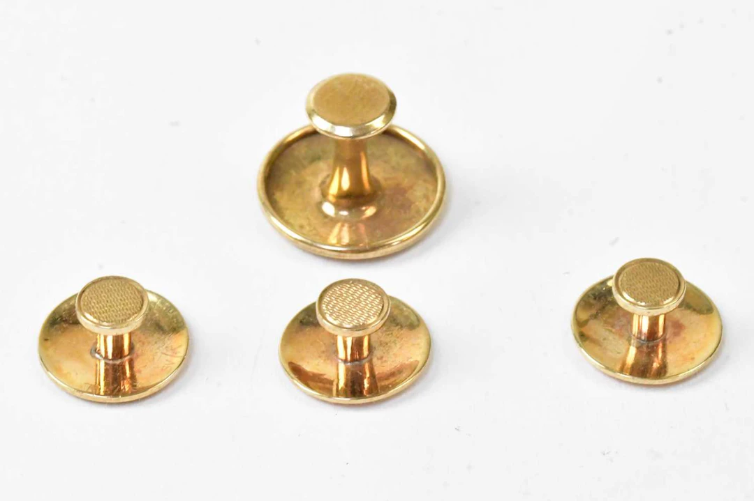 A set of four 9ct yellow gold collar studs