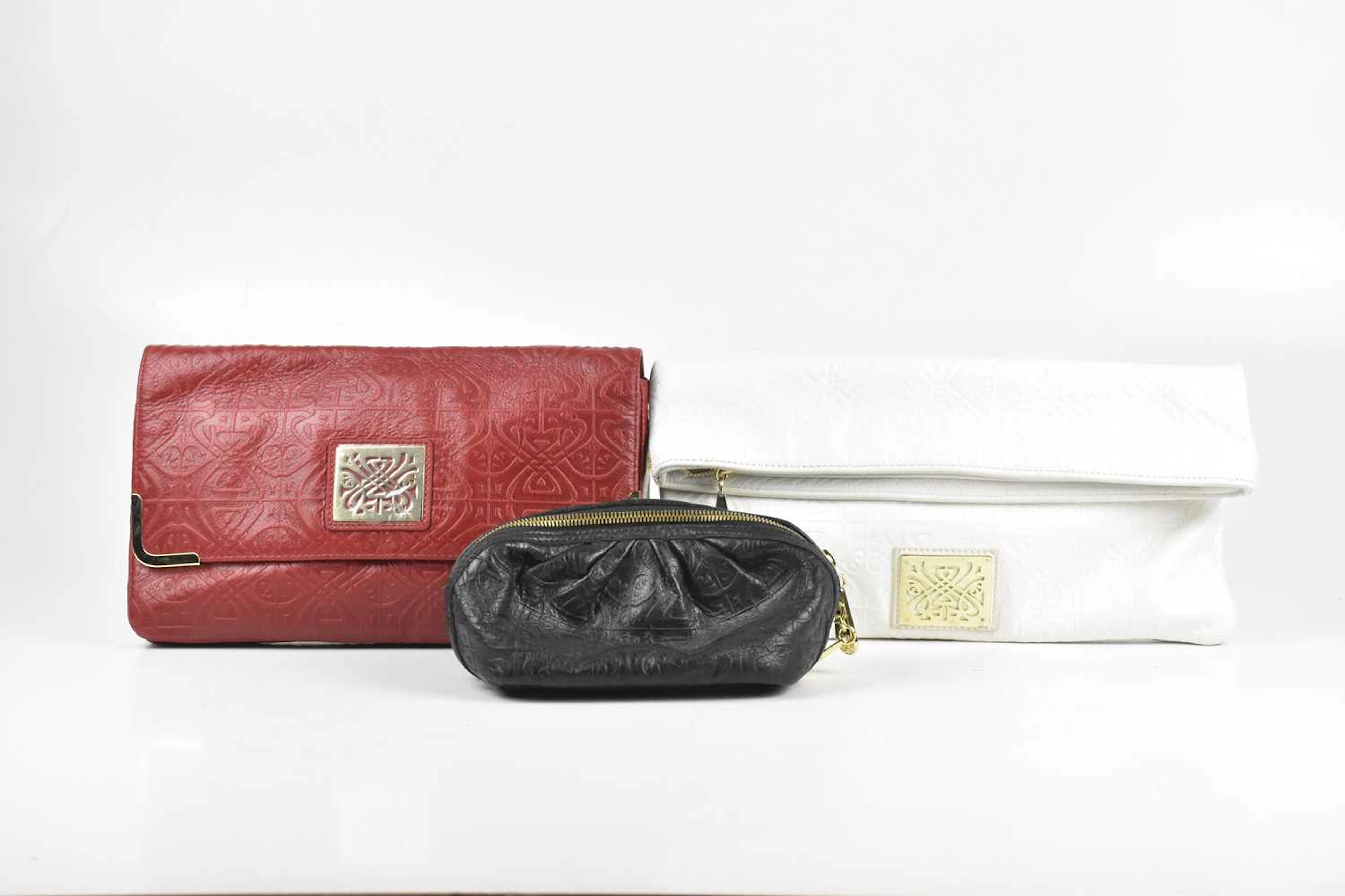 BIBA; a white embossed leather foldover clutch bag with zip top