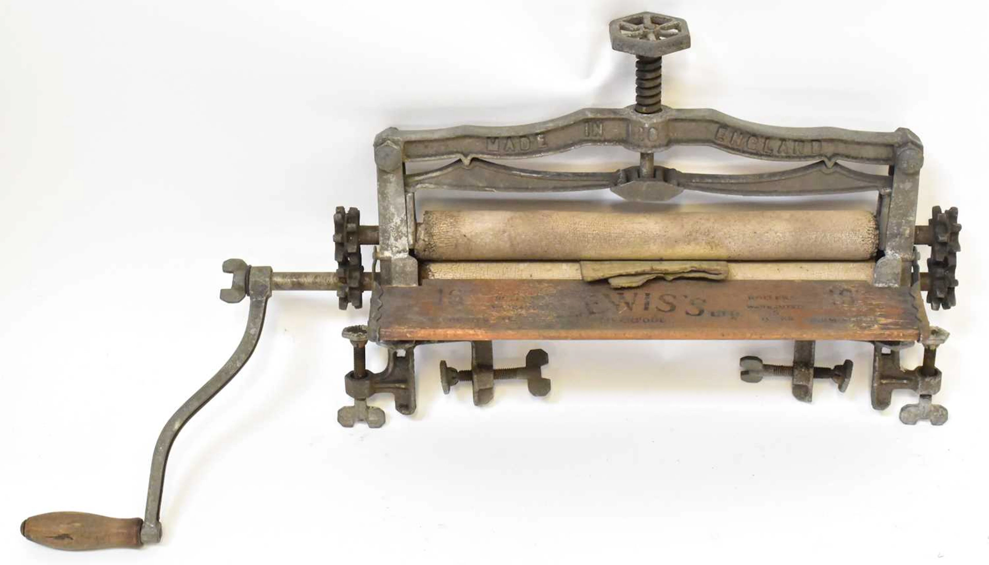 A vintage Acme sink-mounted clothes mangle/wringer