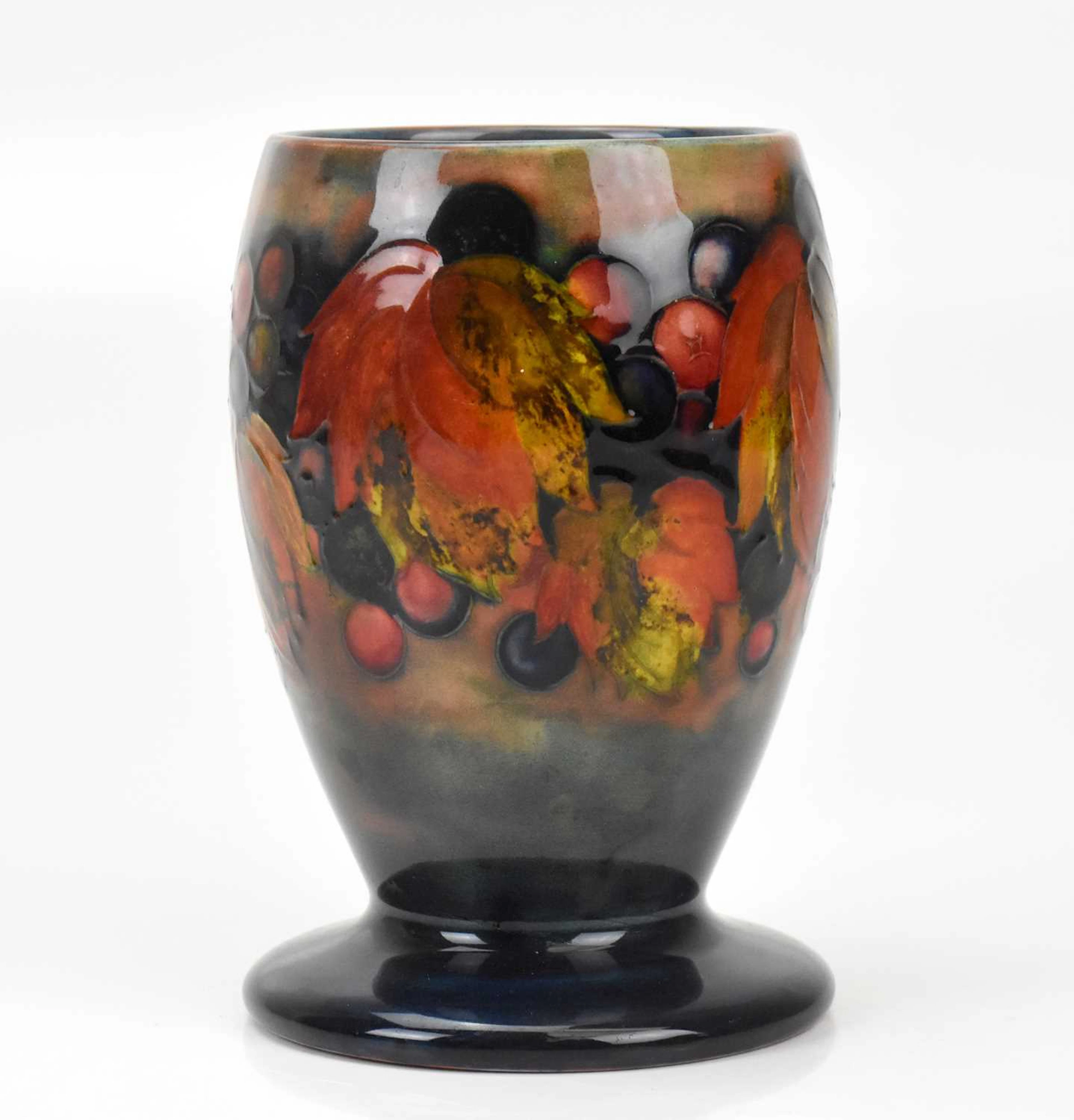 WILLIAM MOORCROFT; a flambé vase of footed ovoid form