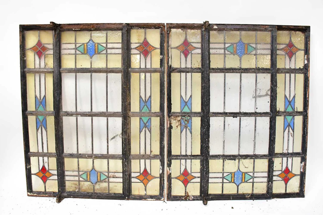 Two late 19th/early 20th century stained glass windows in metal frames