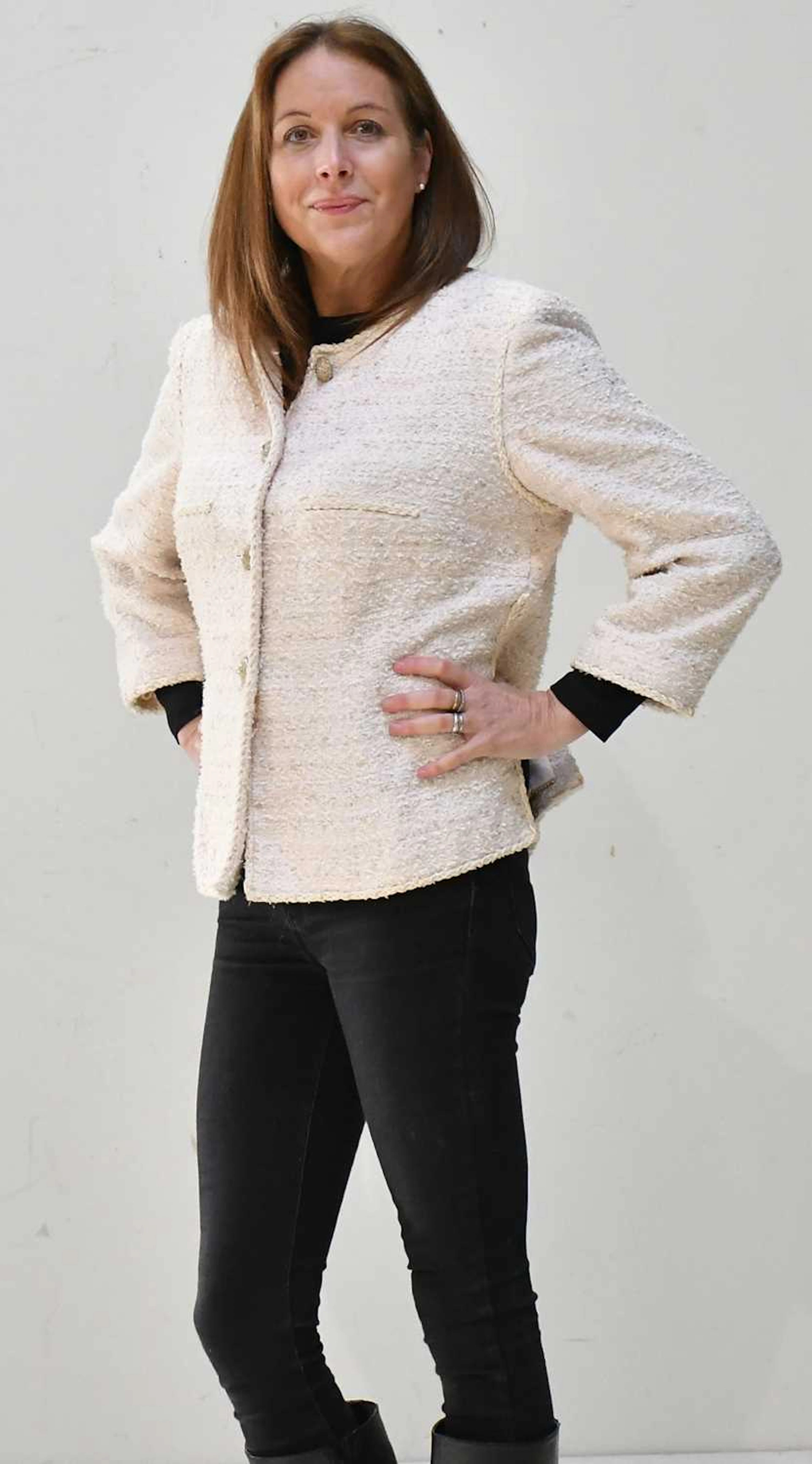 CHANEL; a cream and dusky pink bouclé tweed jacket