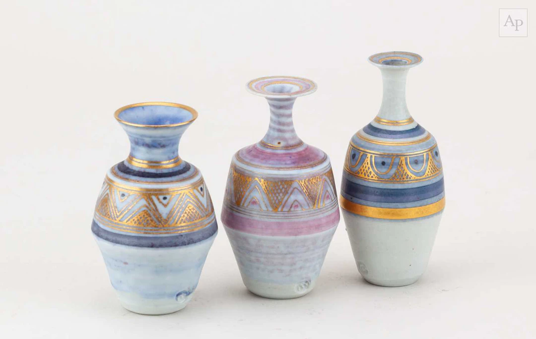 MARY RICH (1940-2022); a trio of small porcelain bottles...