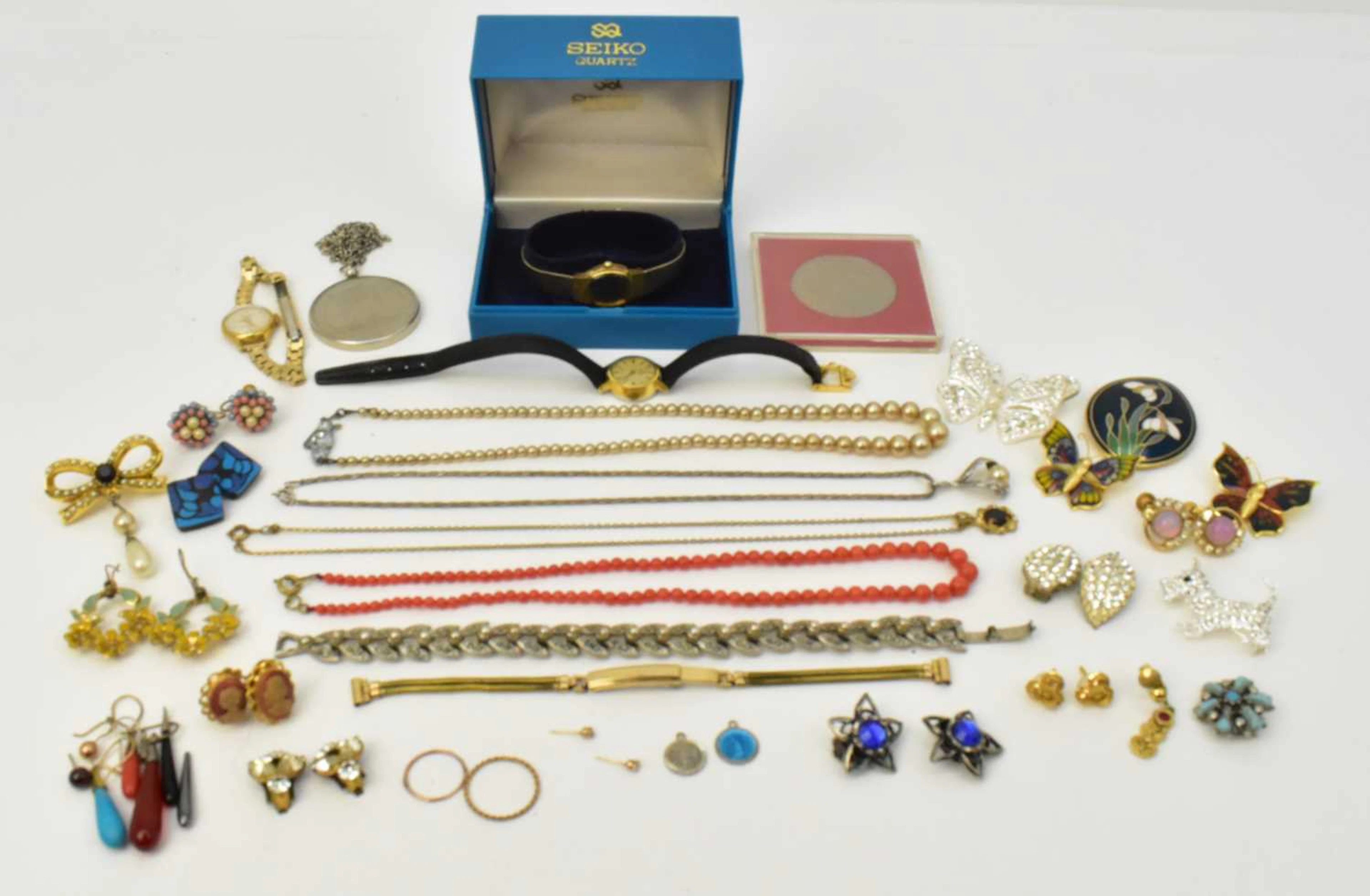 A group of various items of costume jewellery including a...