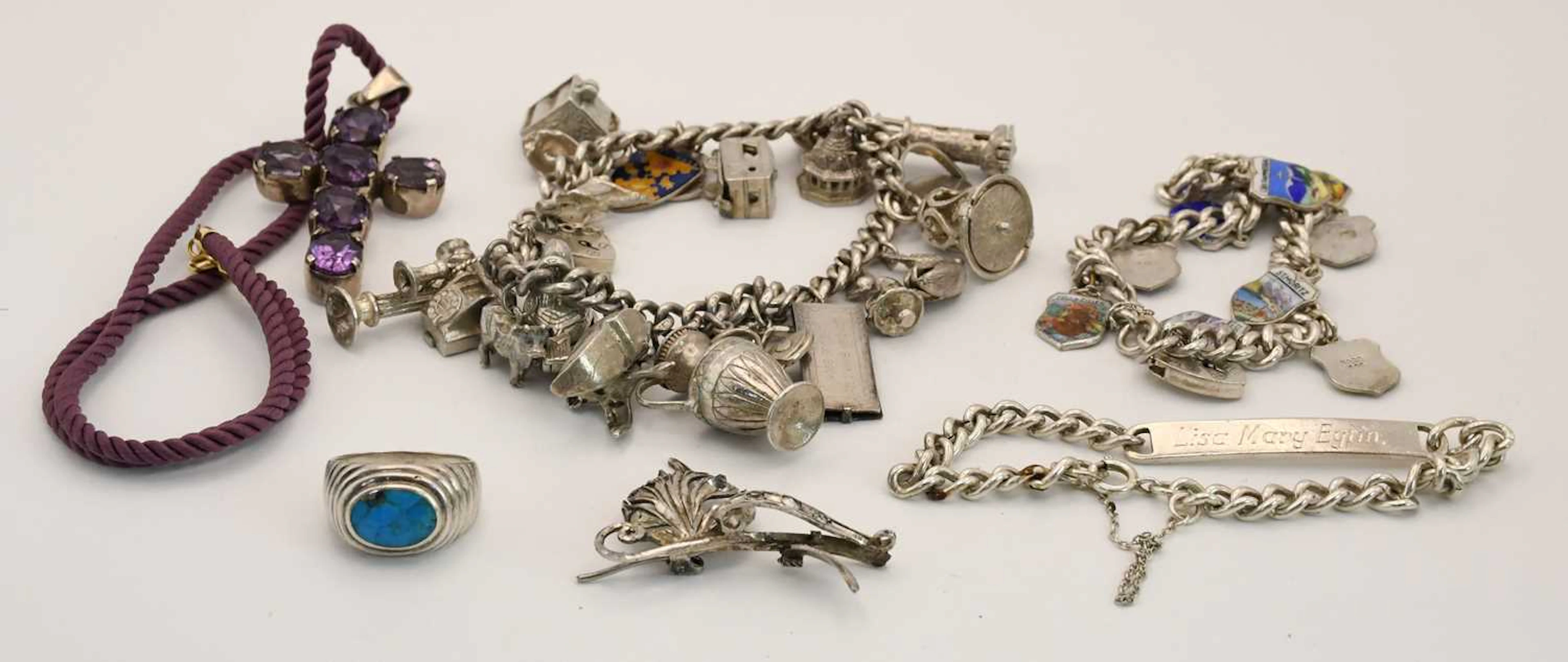 Various items of silver jewellery comprising two charm bracelets