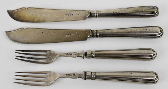 A pair of Victorian hallmarked silver fish knives