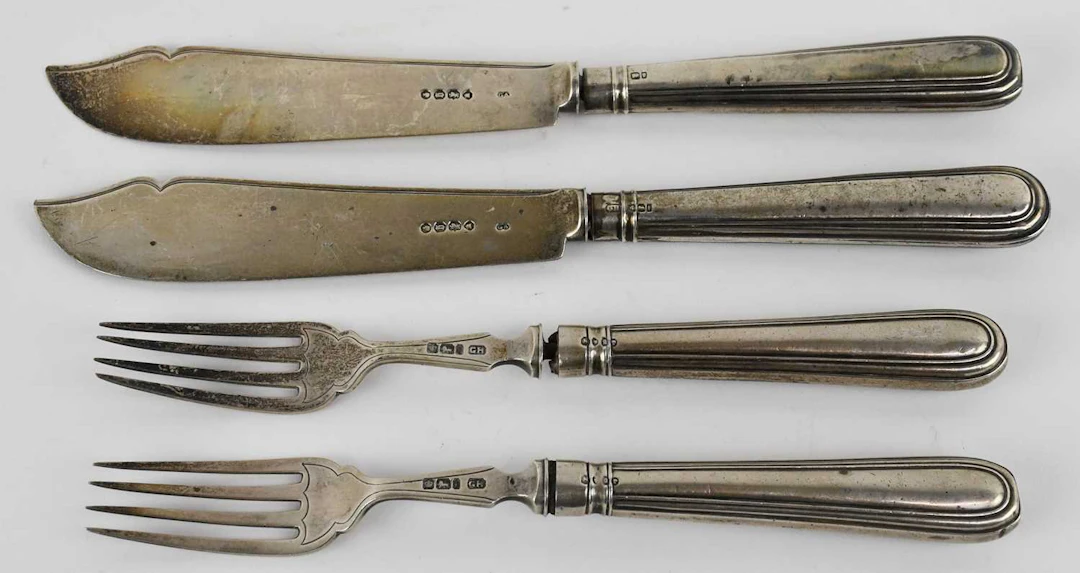 A pair of Victorian hallmarked silver fish knives