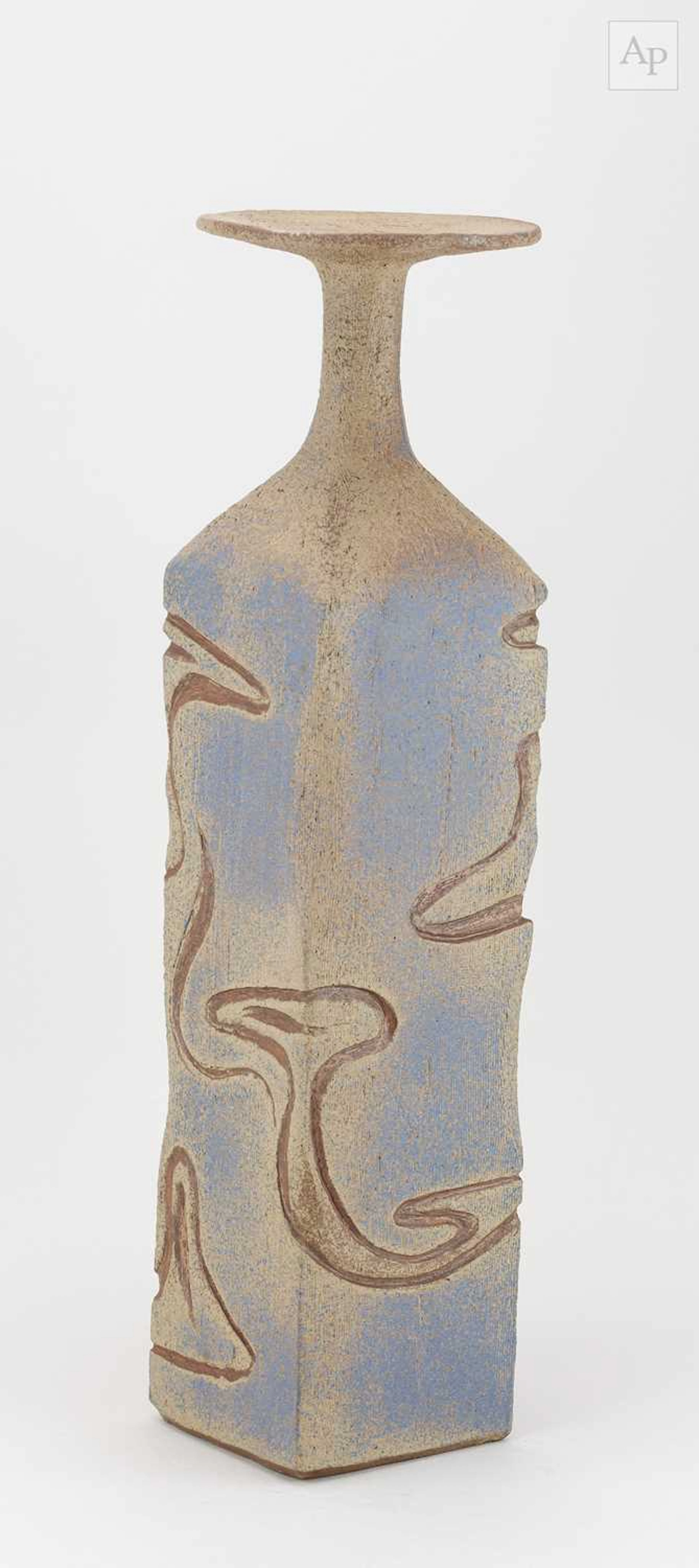A tall square stoneware bottle with disc rim and textured...