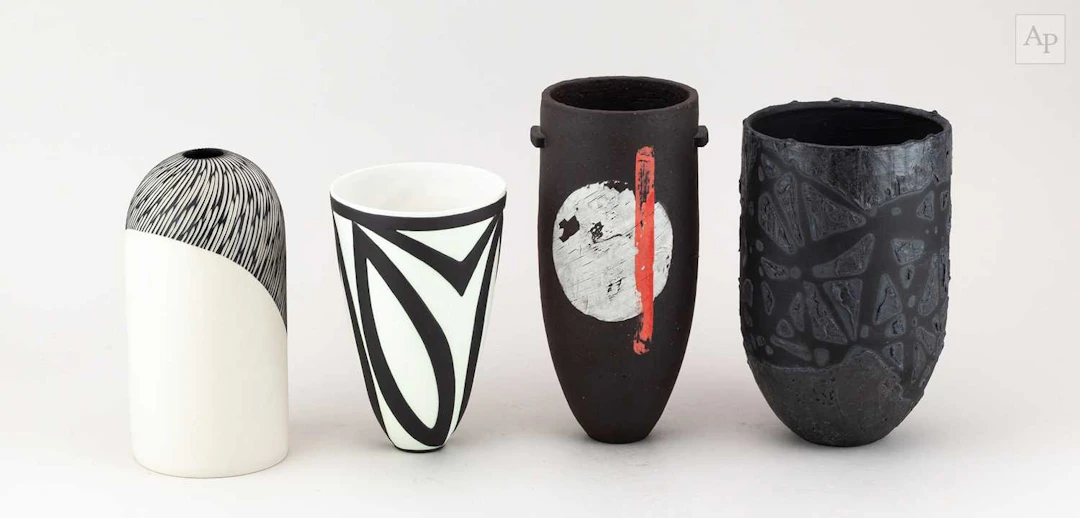 SUZI HUMPHRIES; a stoneware vessel with textured surface covered in black glaze