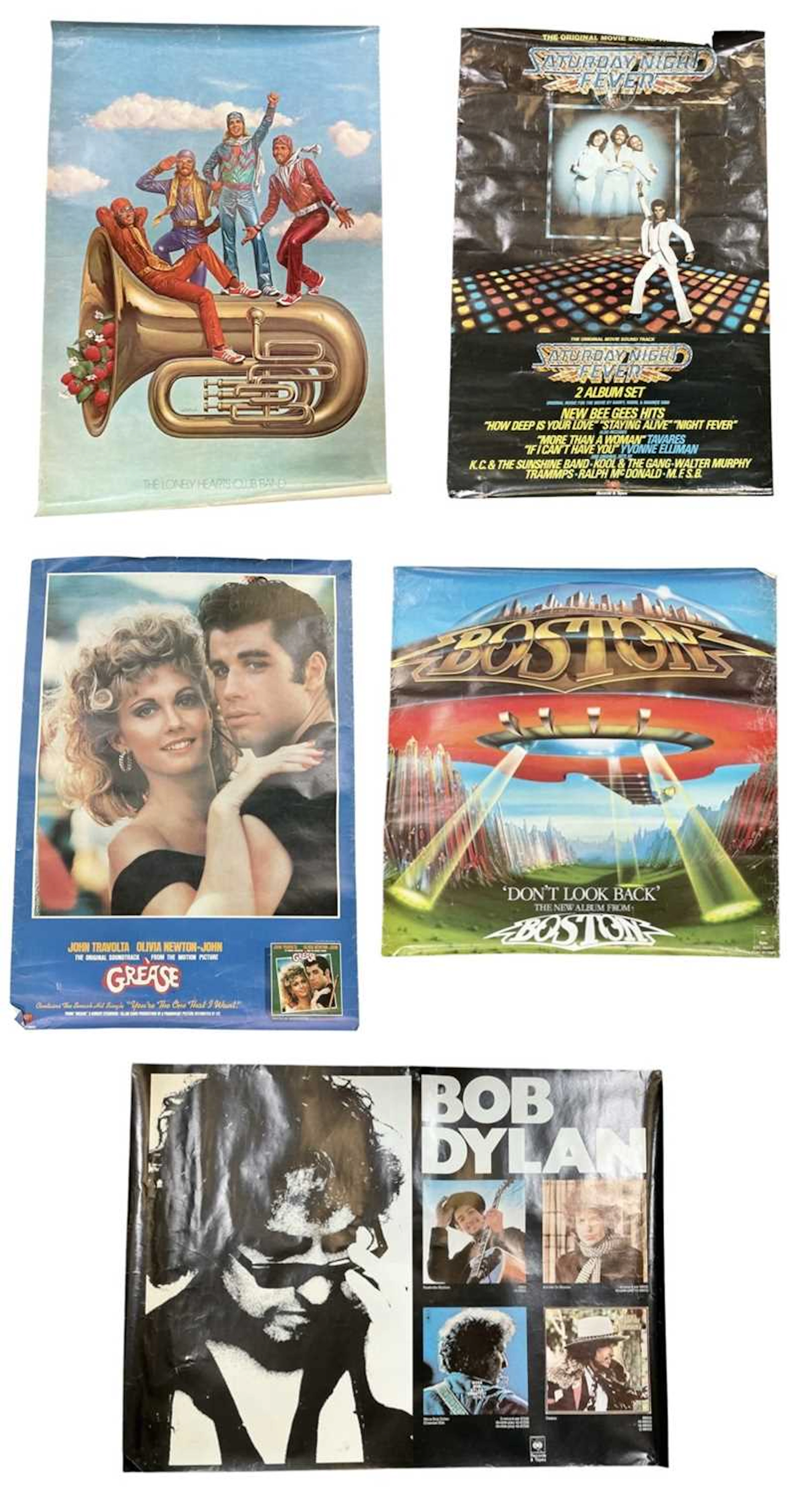 A collection of approximately forty 1950s and later film and music posters