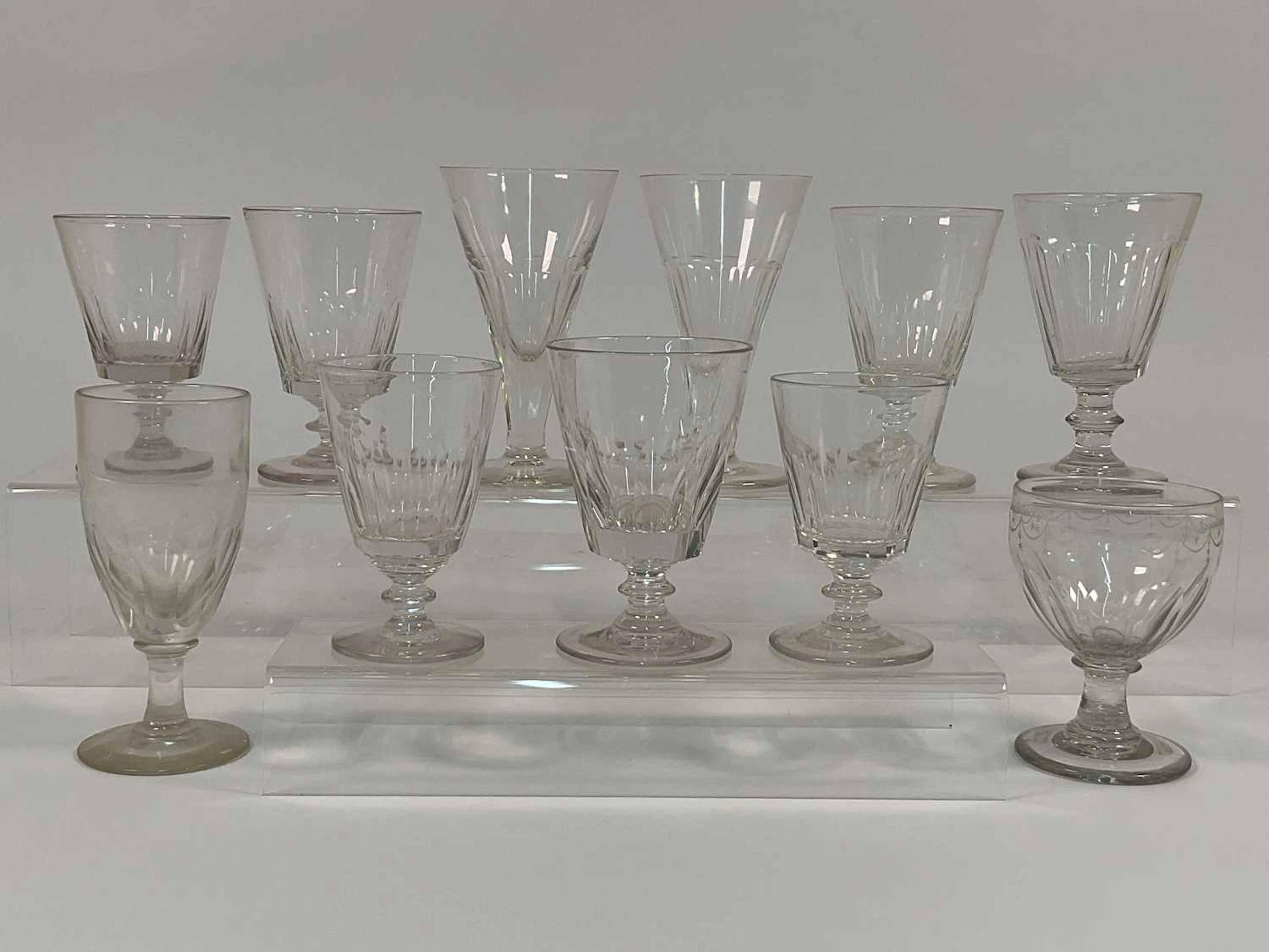 A group of Georgian and later cut glass rummers and wine glasses