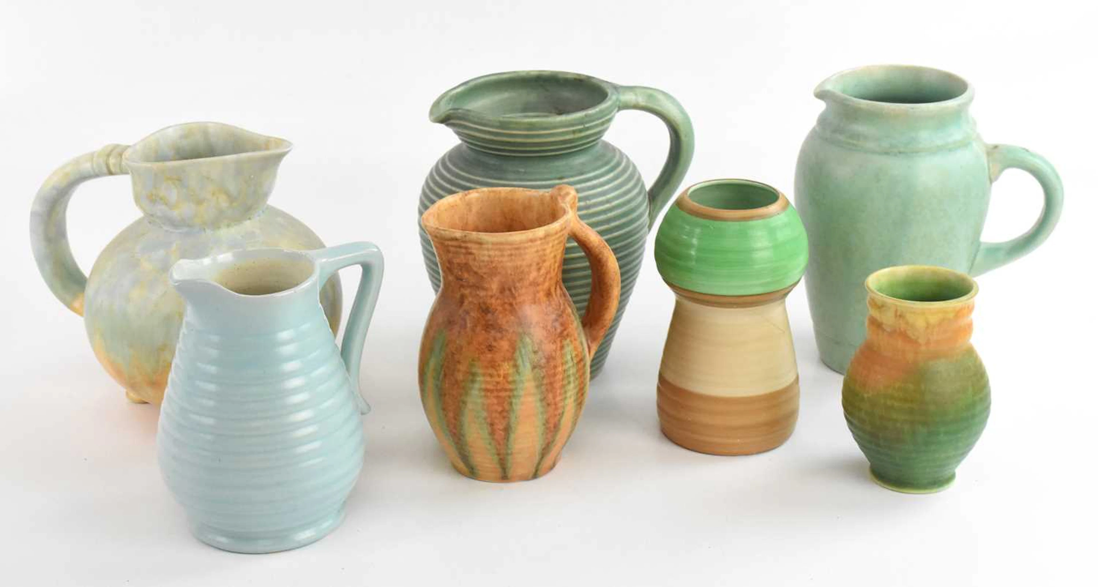 Seven 1930s ceramic jugs and vases