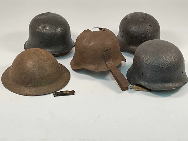 Five WWII helmets