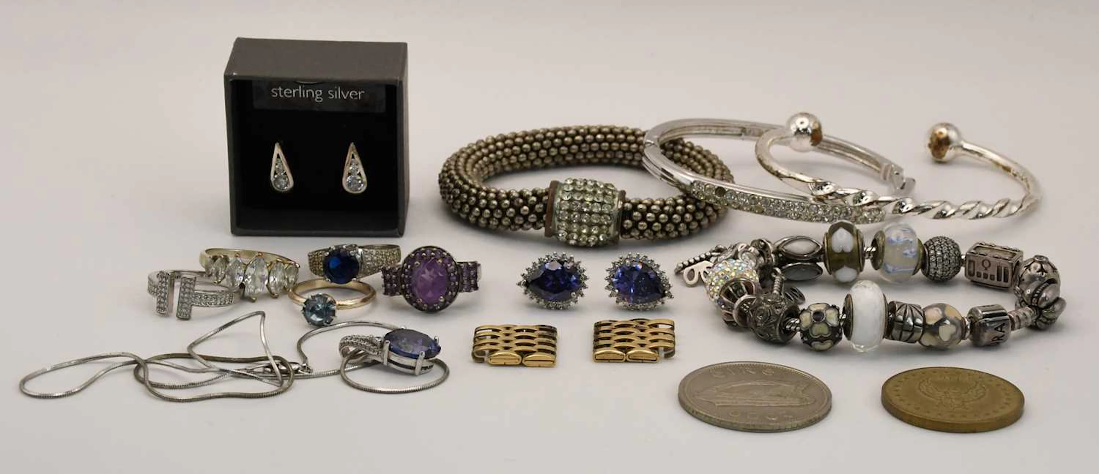 Various items of silver jewellery including hinged...