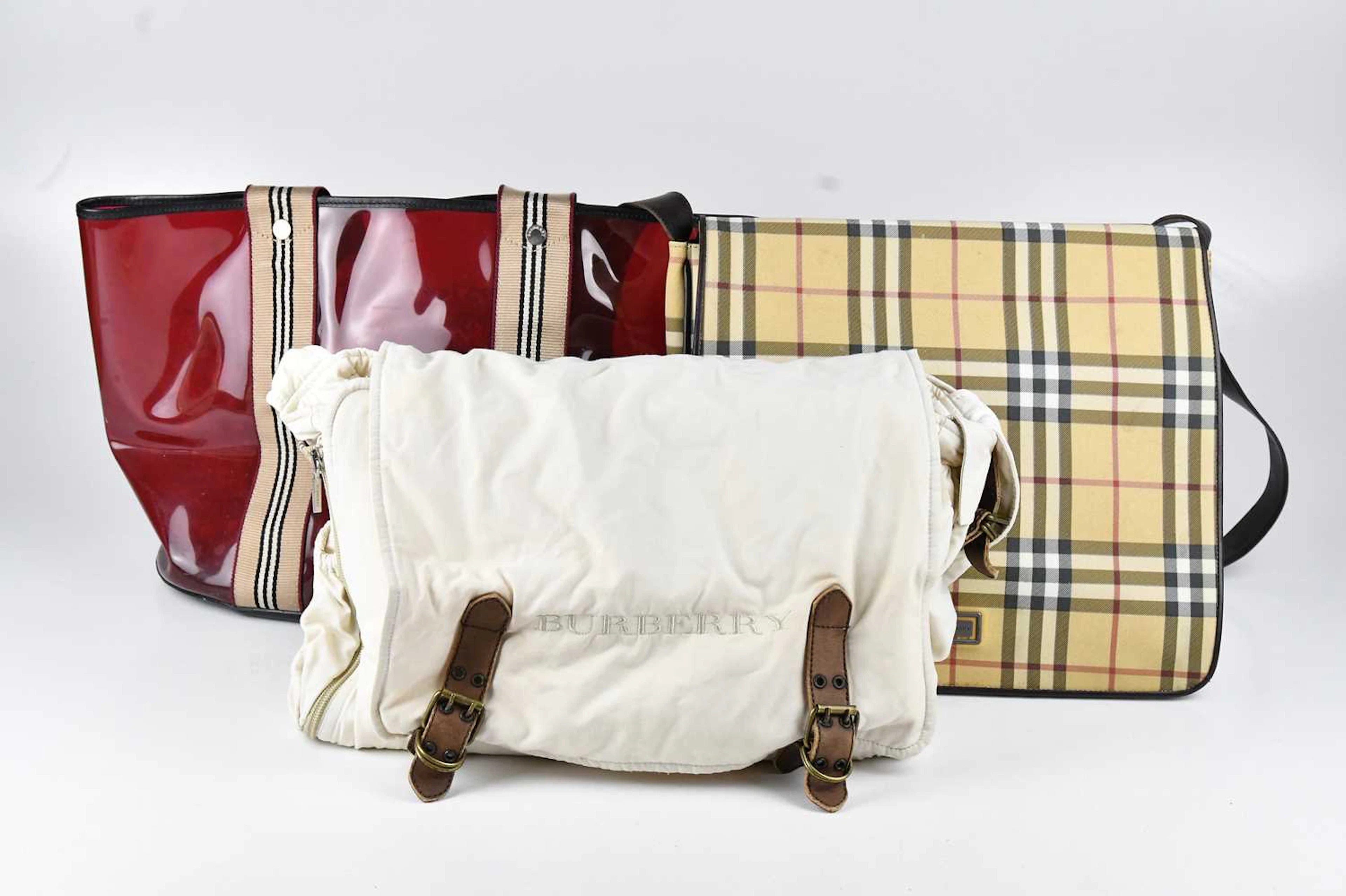 A Nova Check coated canvas flap-over top satchel