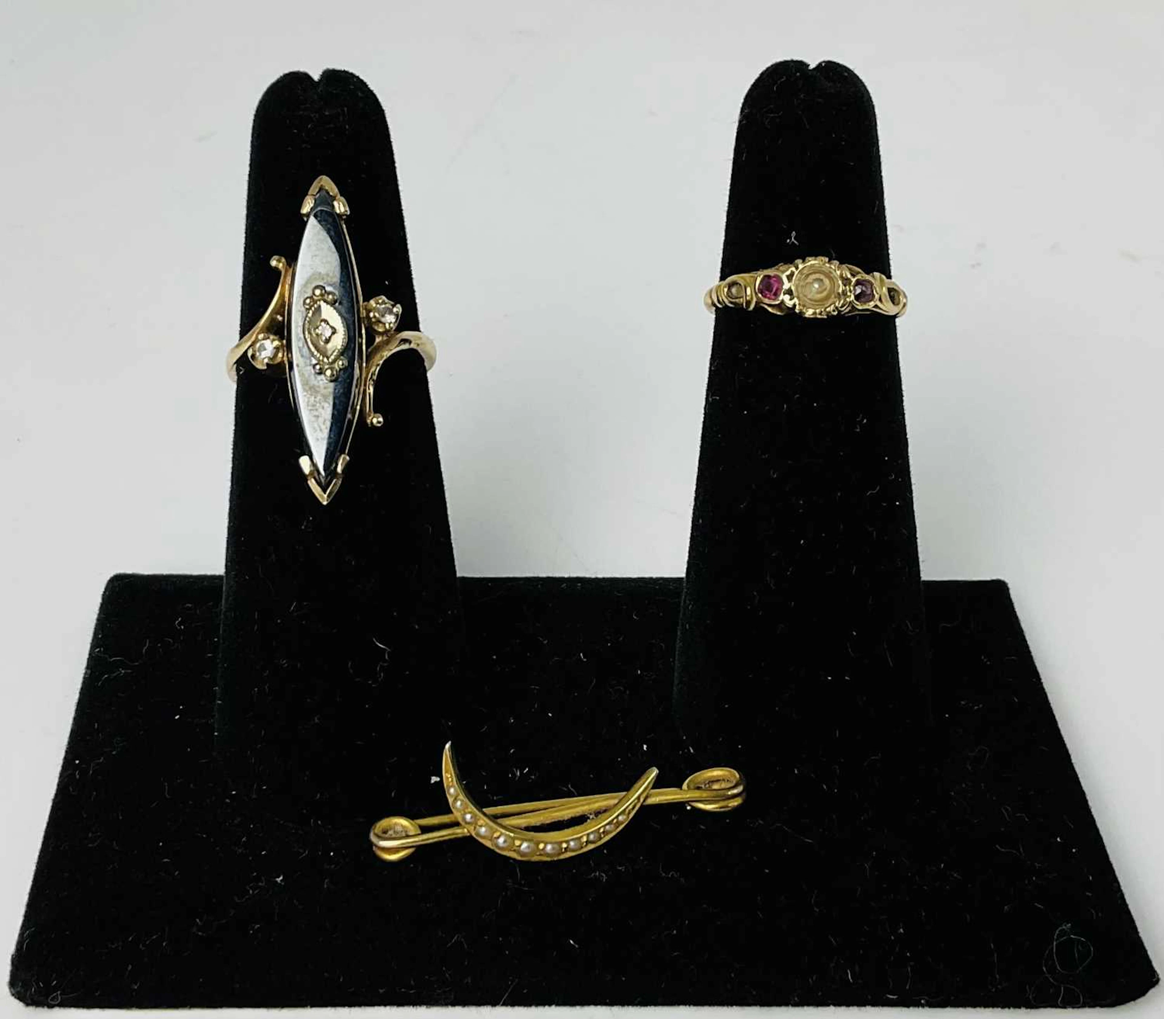 A 10ct yellow gold black onyx and three stone diamond set...