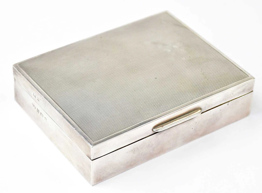 MAPPIN & WEBB LTD; an Elizabeth II hallmarked silver cigarette box