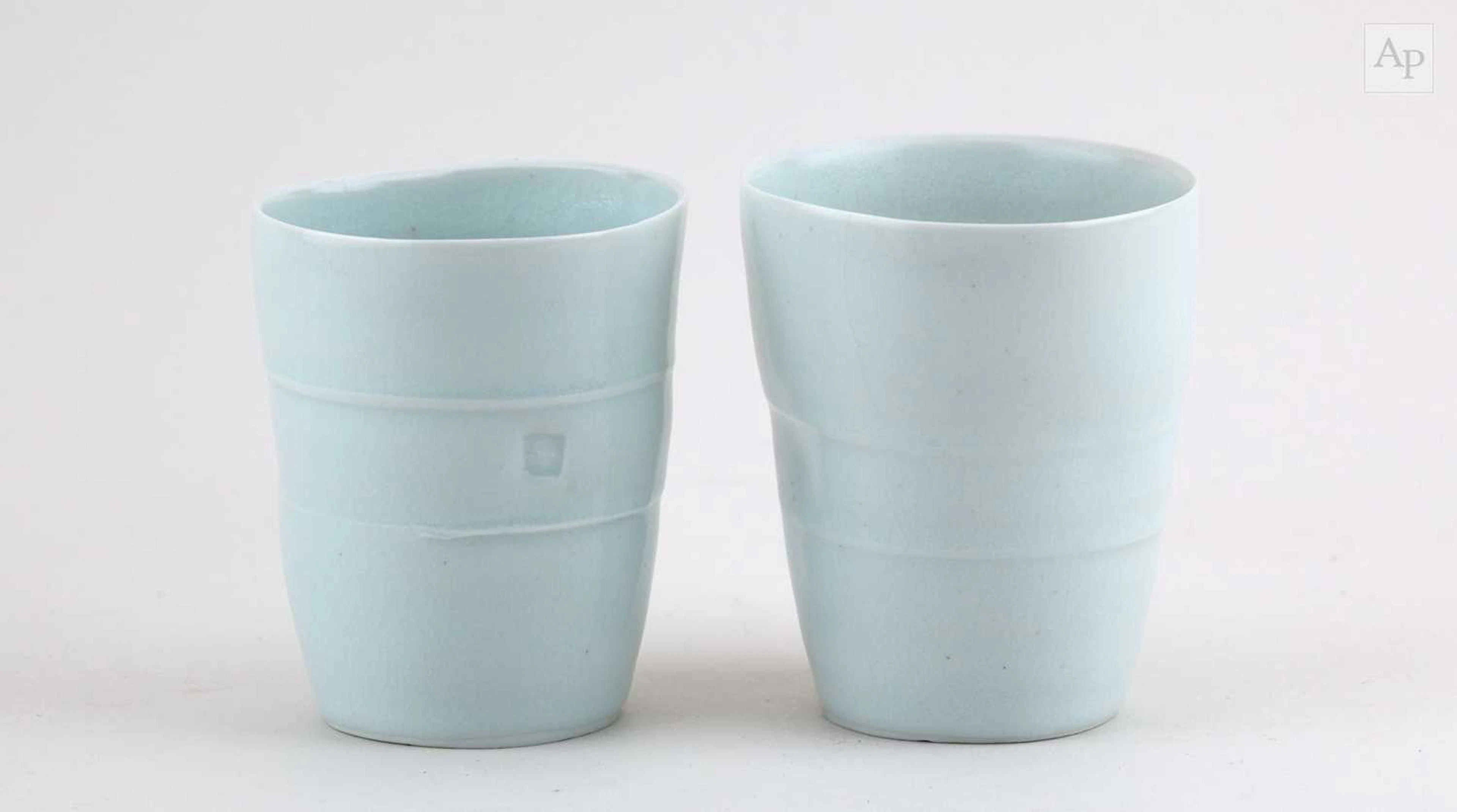 EDMUND DE WAAL (born 1964); a near pair of porcelain...