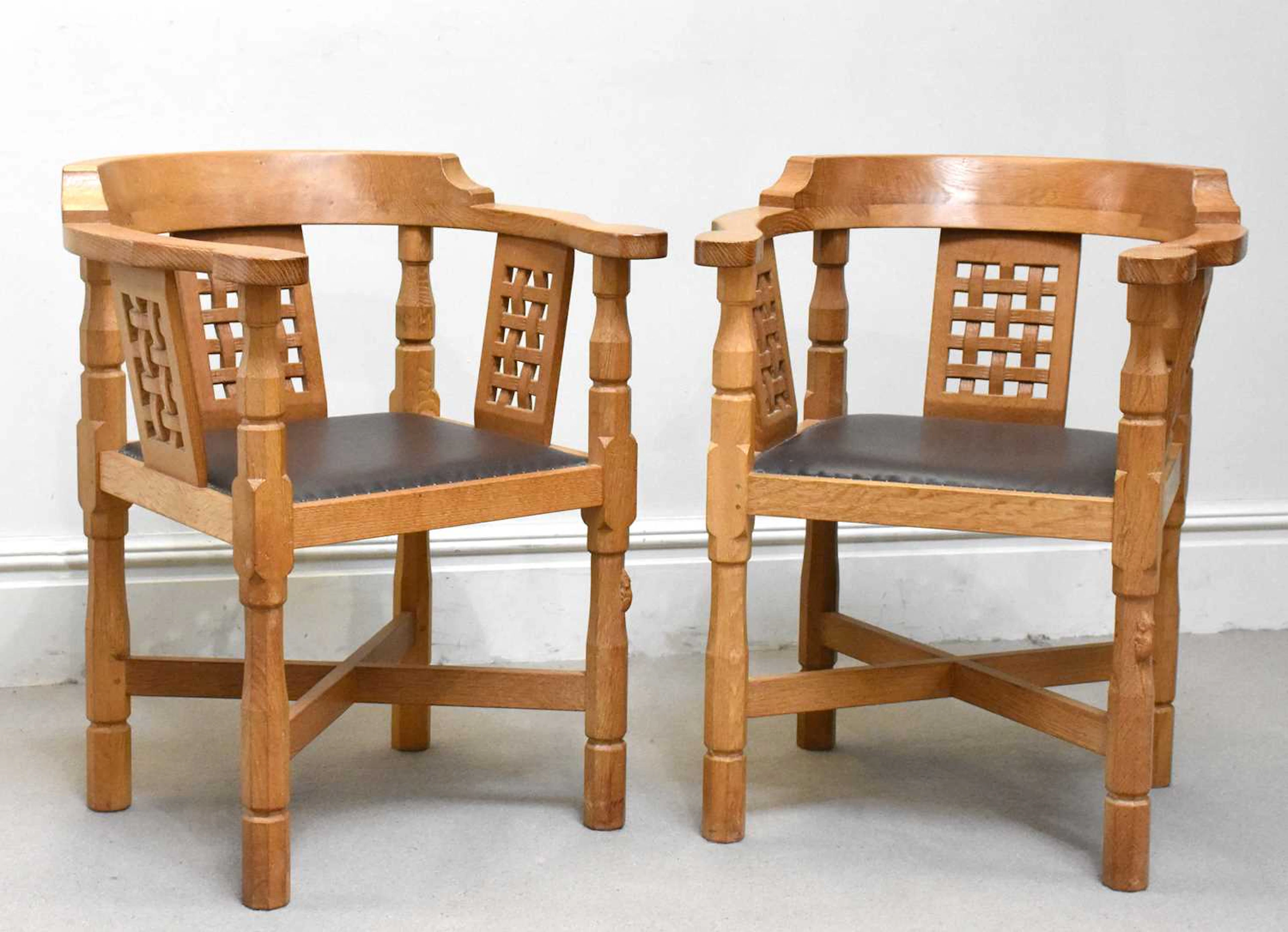 ROBERT ‘MOUSEMAN’ THOMPSON; a pair of carved oak ‘Monk’ chairs
