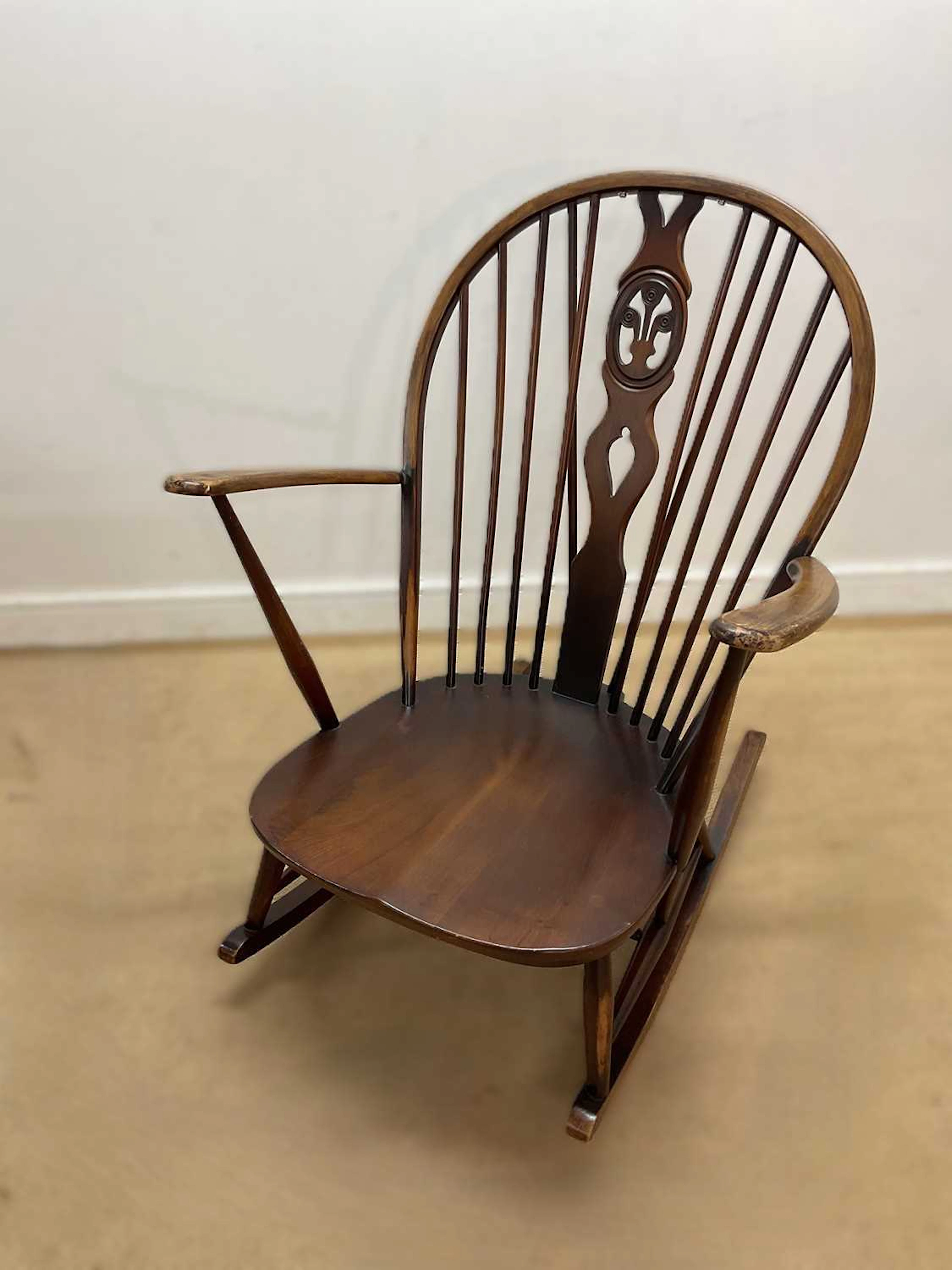 ERCOL; a stained beech rocking chair