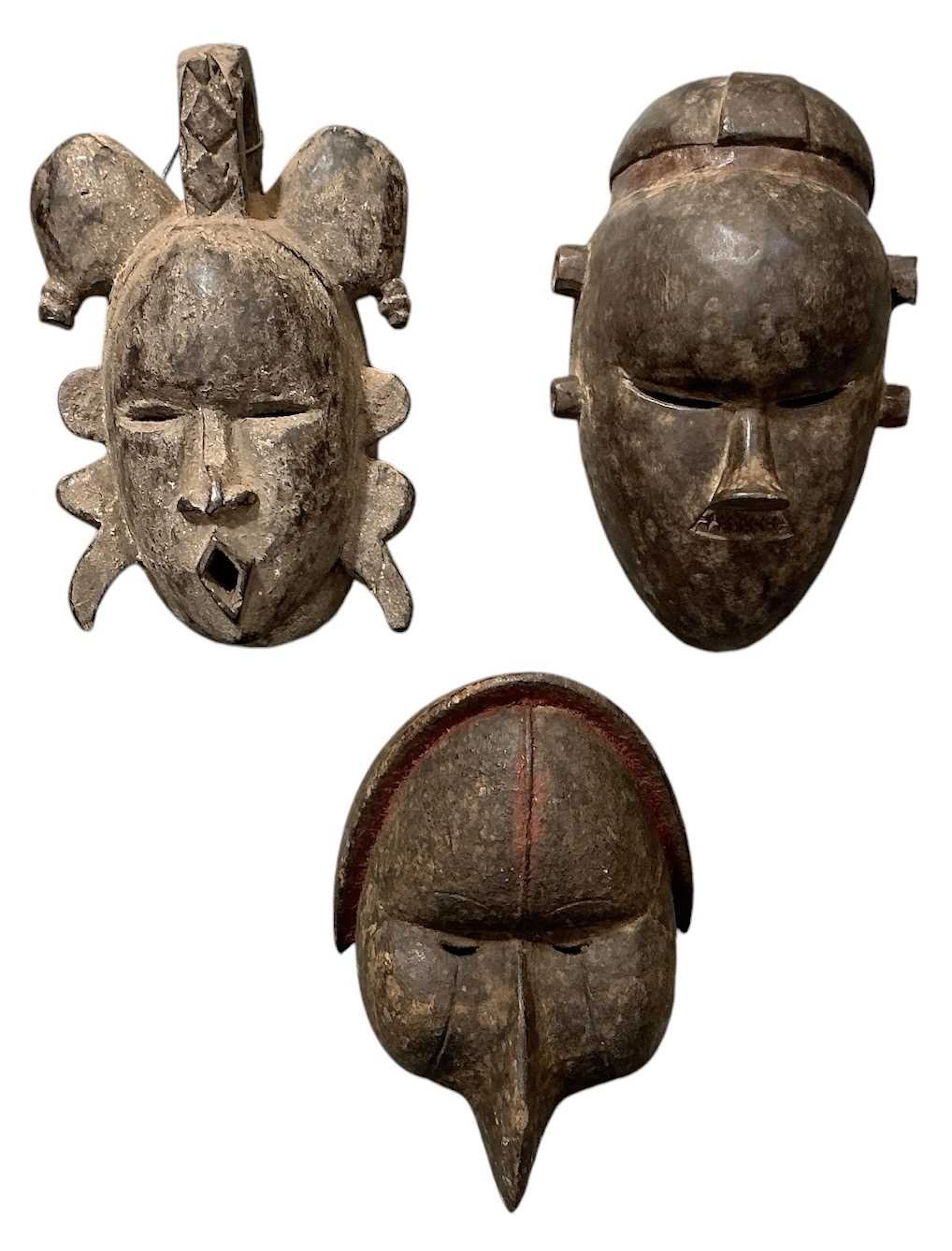 Three African tribal carved wooden masks