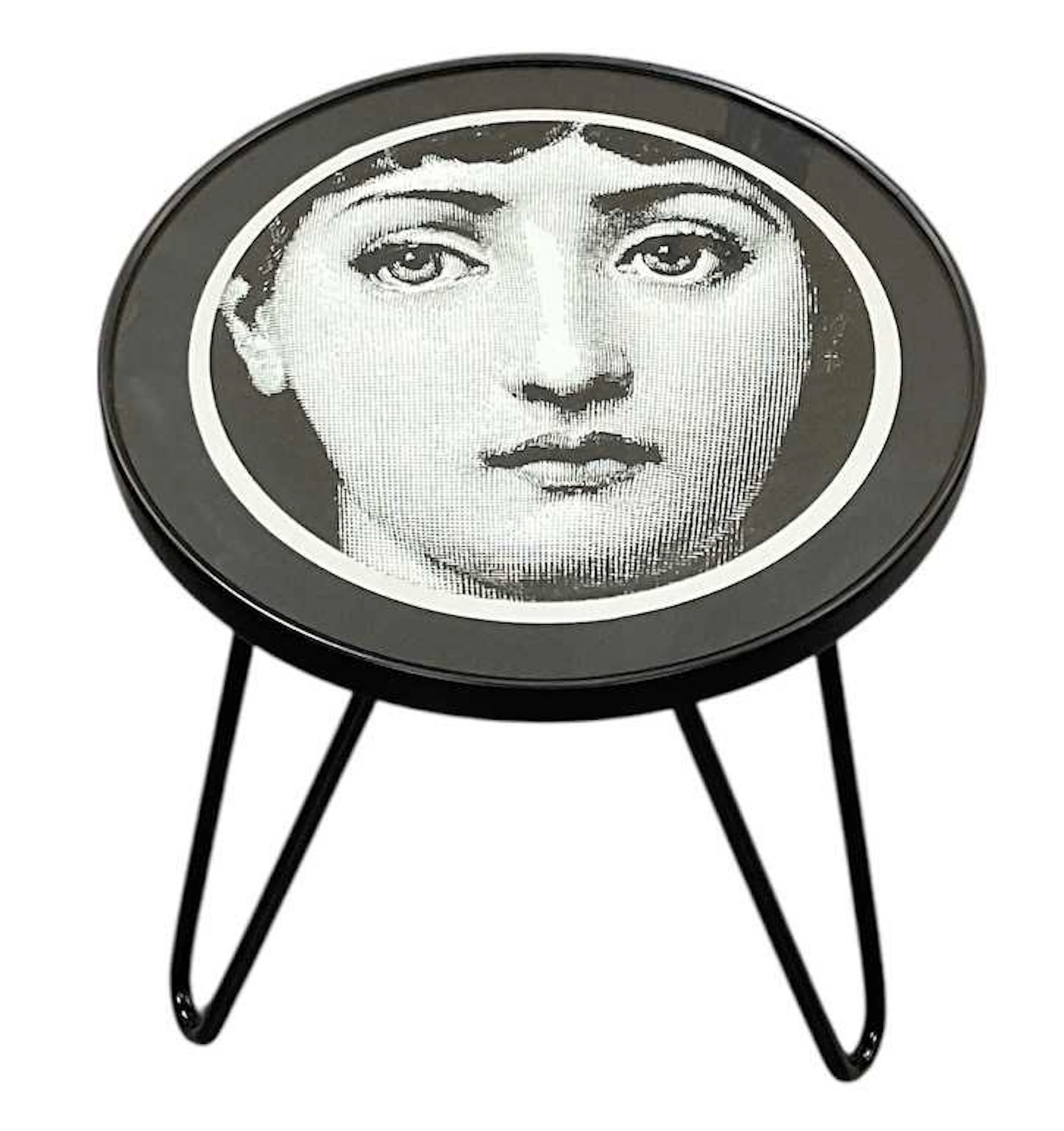 AFTER PIERO FORNASETTI; a Fornasetti Collection occasional table